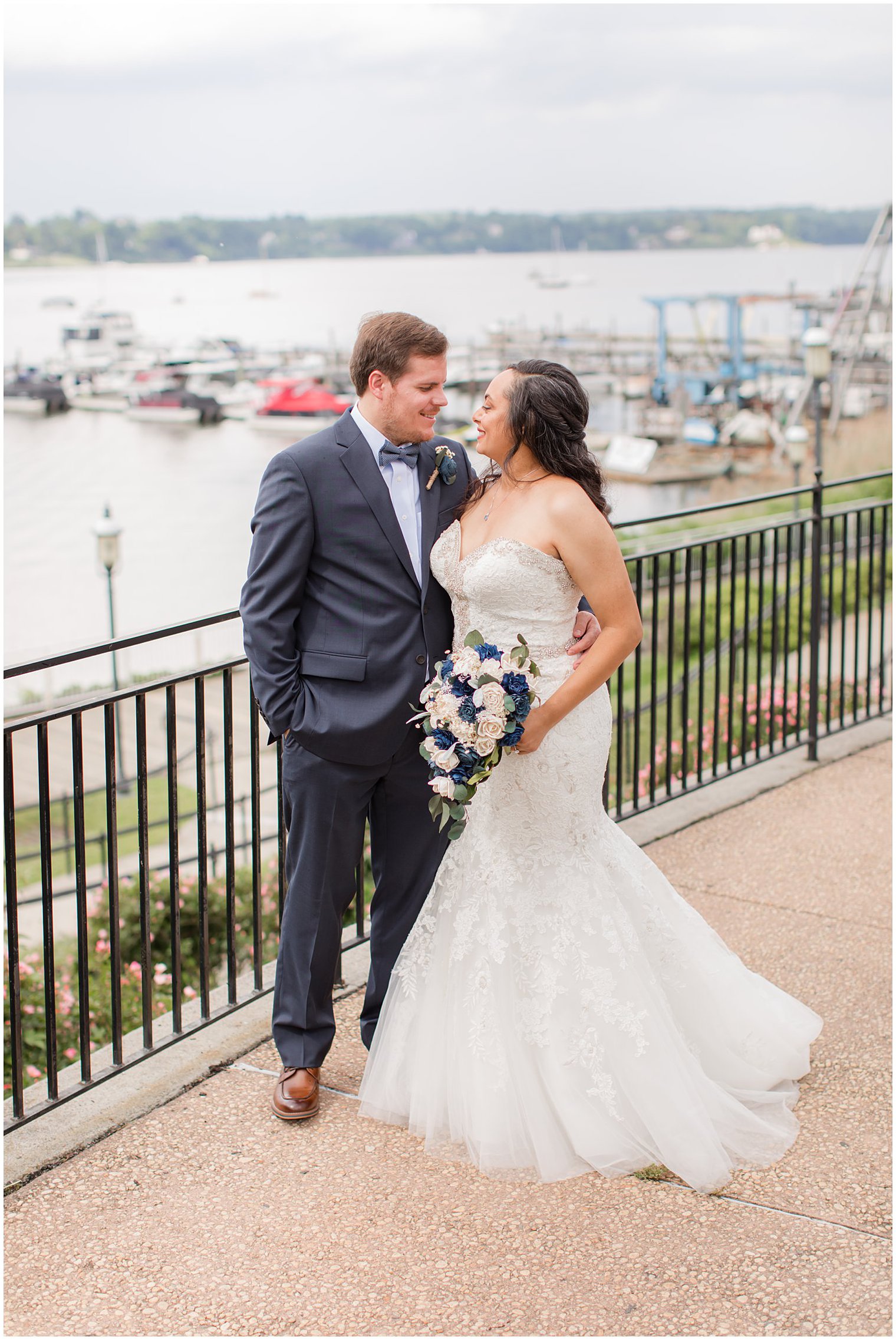 couple smiles together on walkway in Red Bank NJ