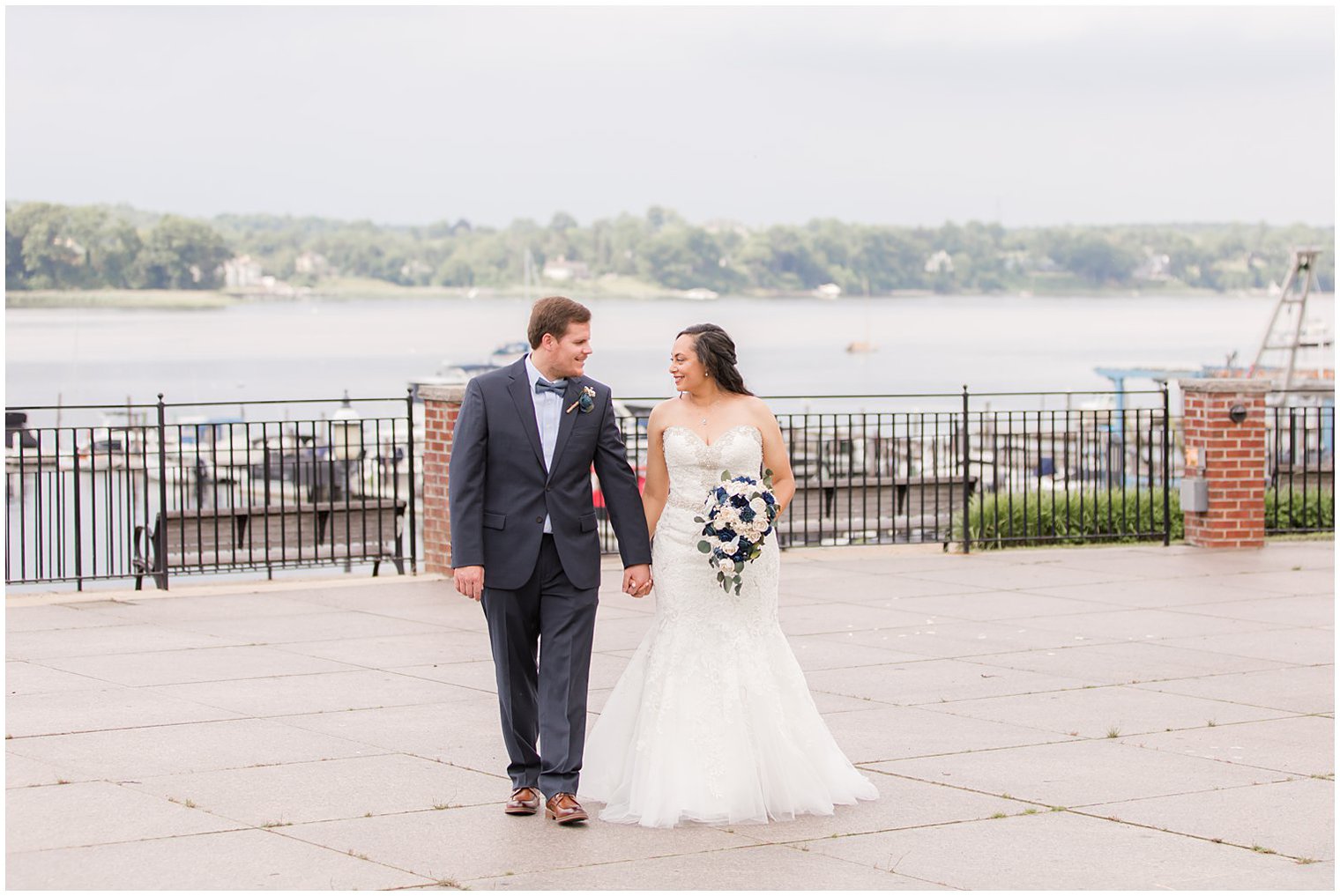 bride and groom hold hands walking before Red Bank, NJ wedding