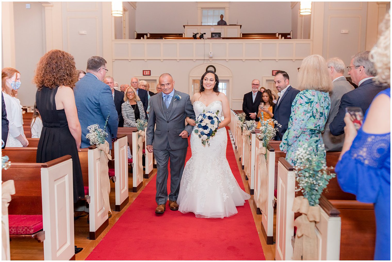 bride walks into ceremony with dad during traditional church wedding in Red Bank New Jersey 