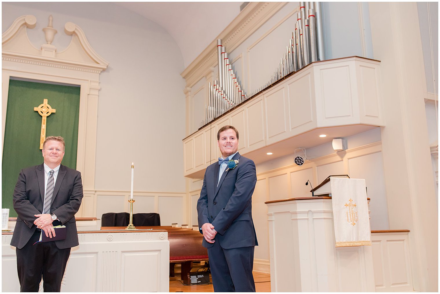 groom watches bride walk down aisle during traditional church wedding in Red Bank New Jersey 