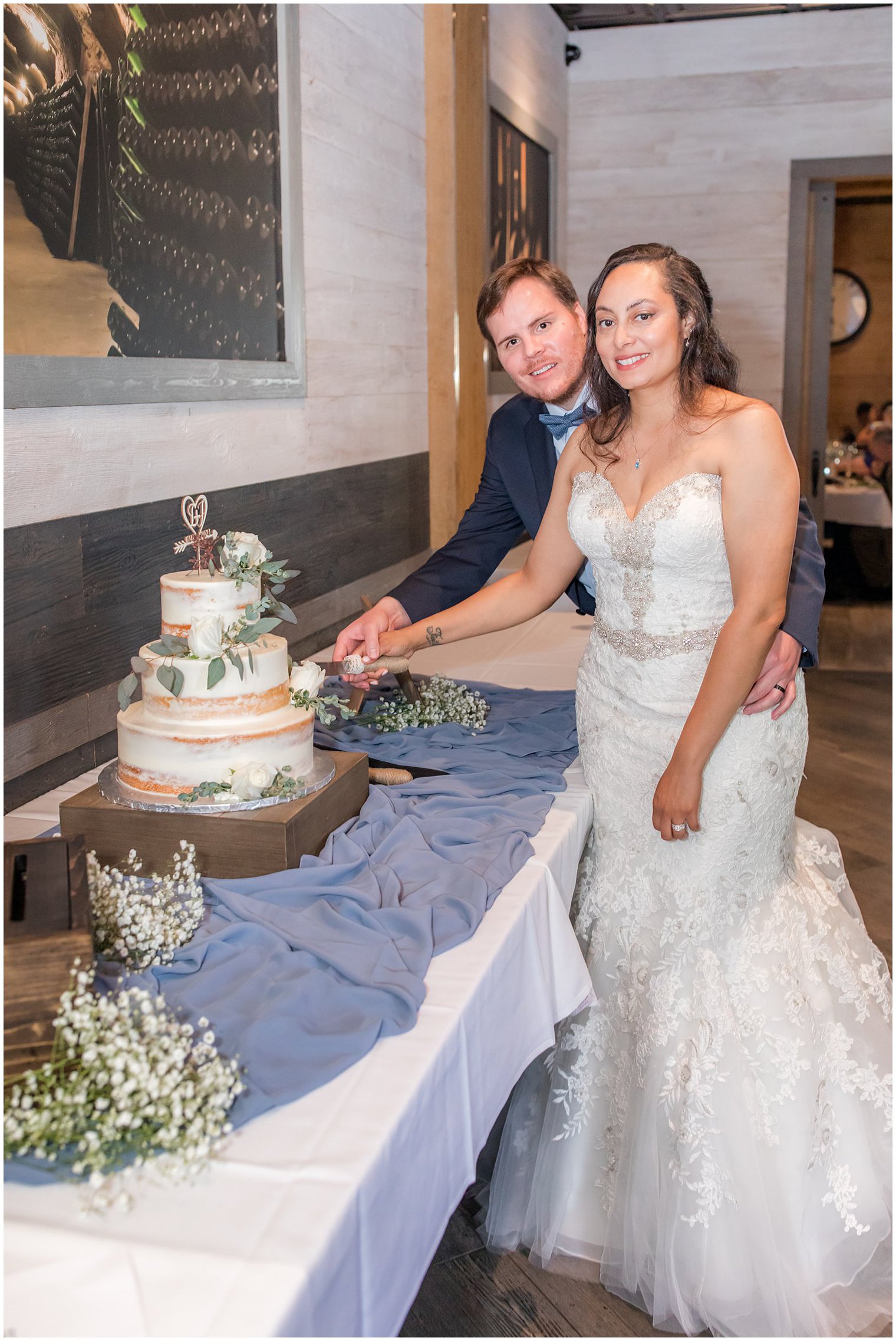 couple cuts wedding cake at Neapoli in Red Bank NJ