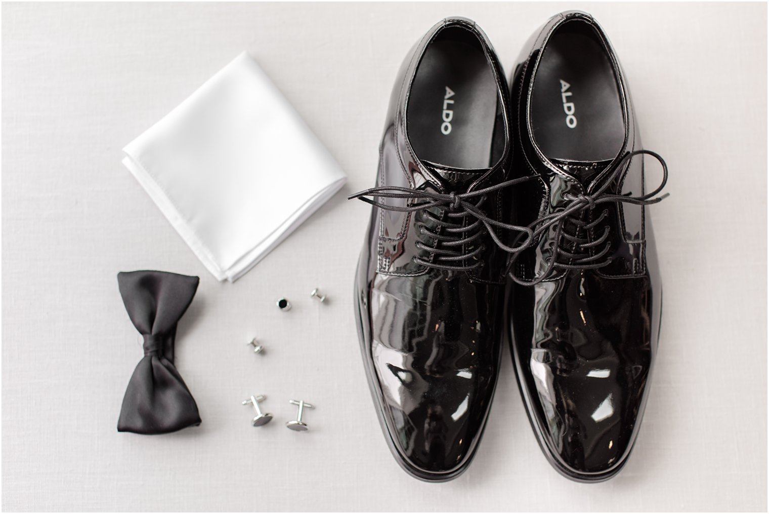 groom's black shoes and classic wedding details 