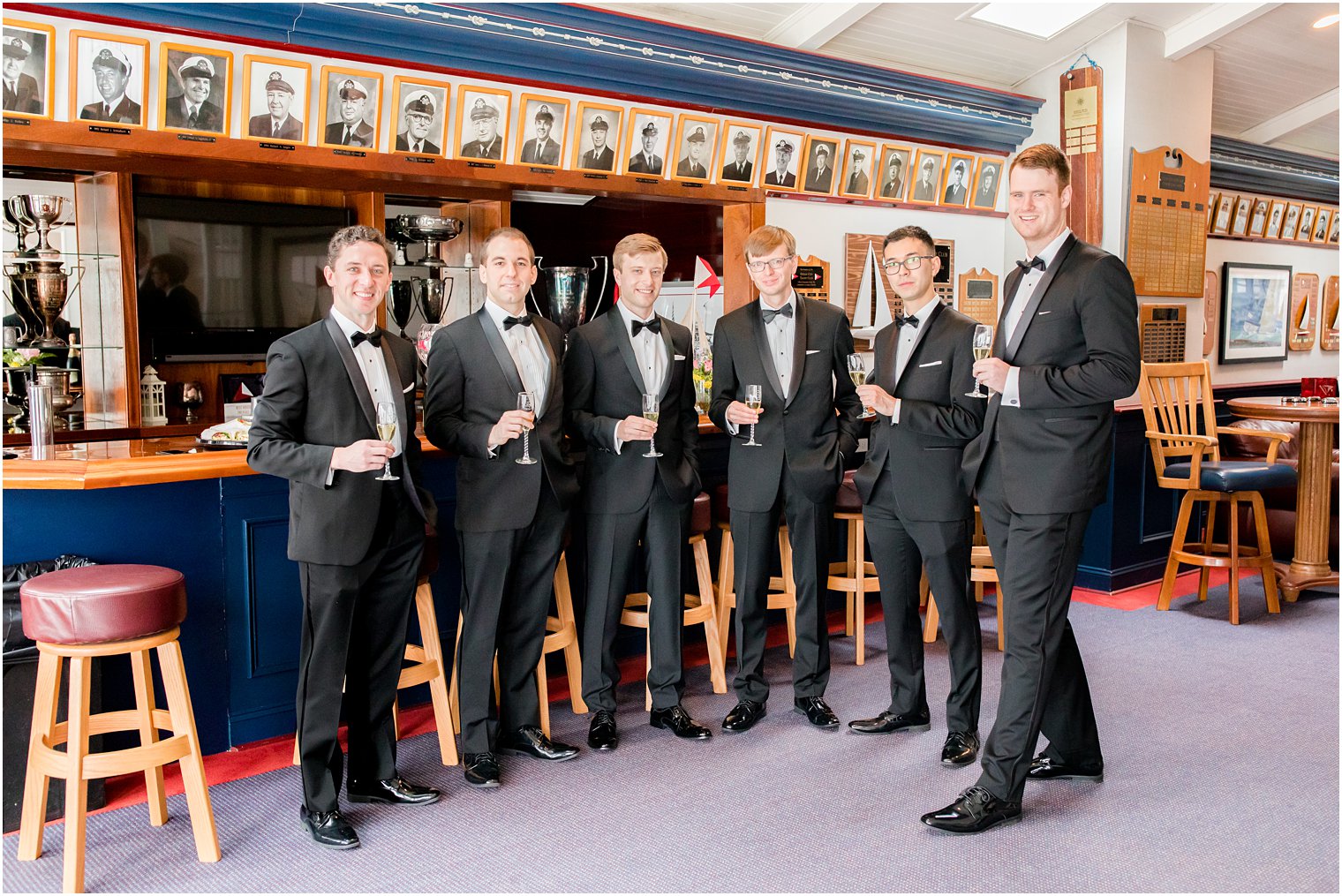 groom and groomsmen toast with champagne at Ocean City Yacht Club