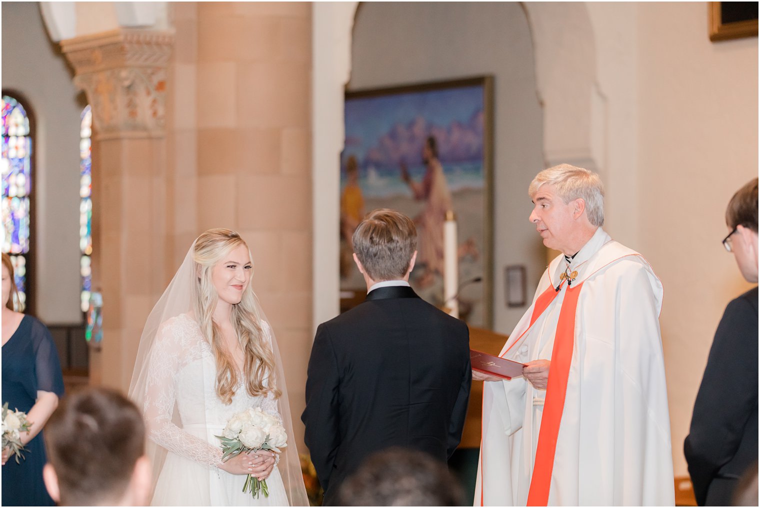 bride smiles during traditional church wedding in Ocean City NJ