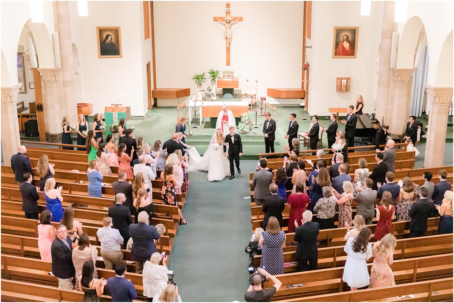 newlyweds leave traditional church wedding in Ocean City NJ