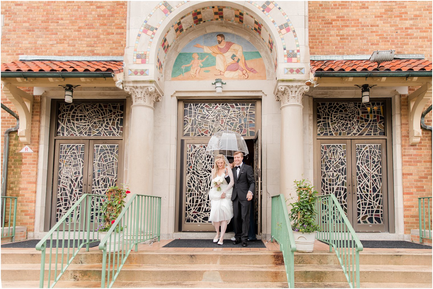 bride and groom leave New Jersey church on rainy wedding day