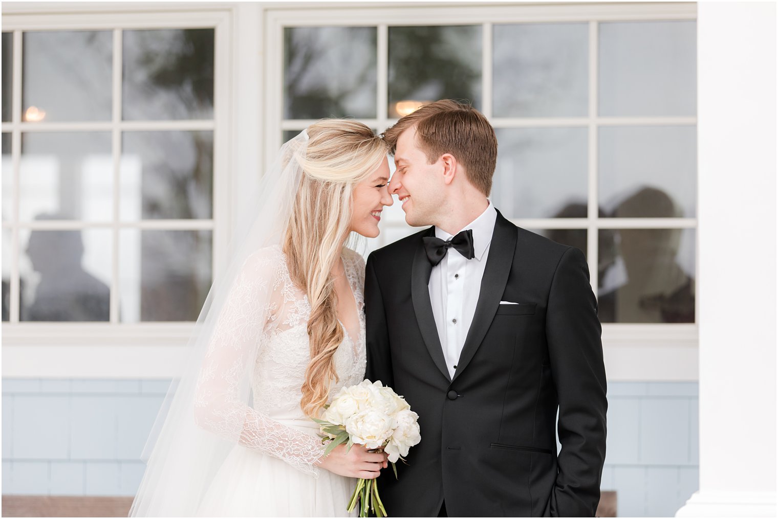 bride and groom touch noses during NJ wedding photos