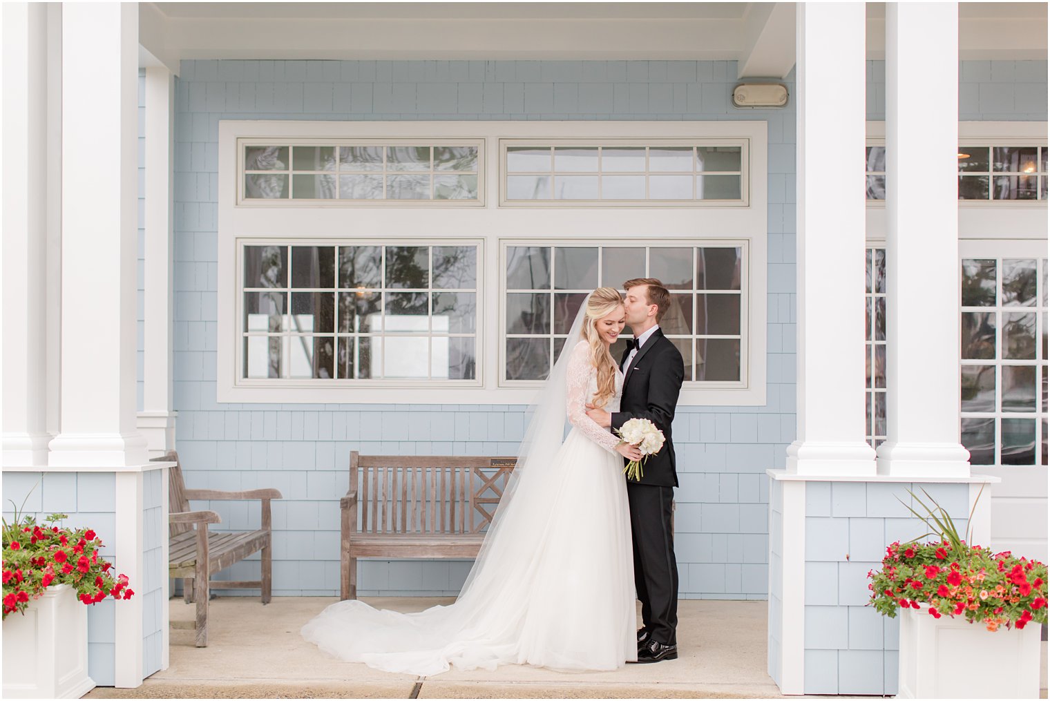 groom kisses bride's cheek during NJ wedding photos 