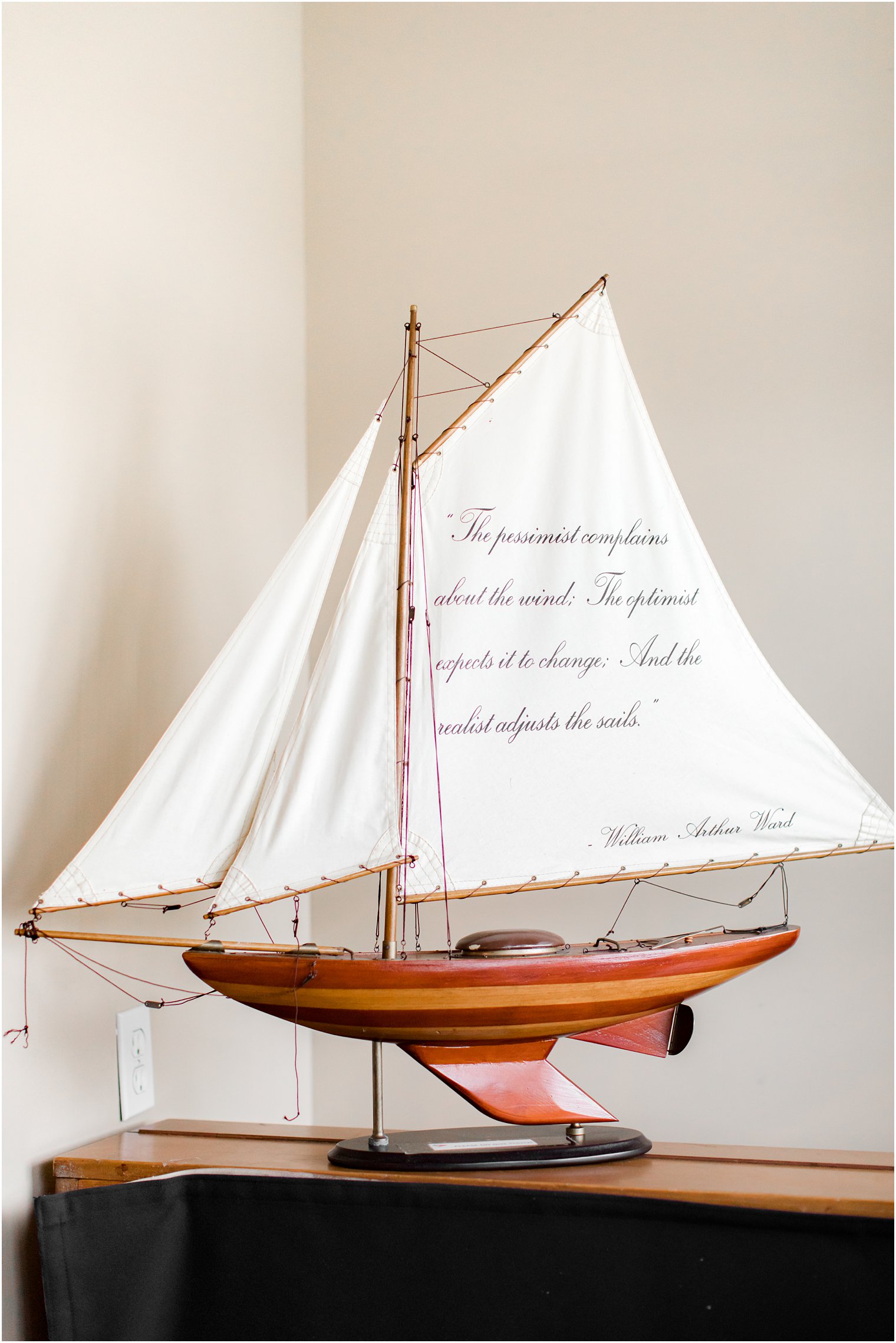 model boat with quote on it for coastal wedding 