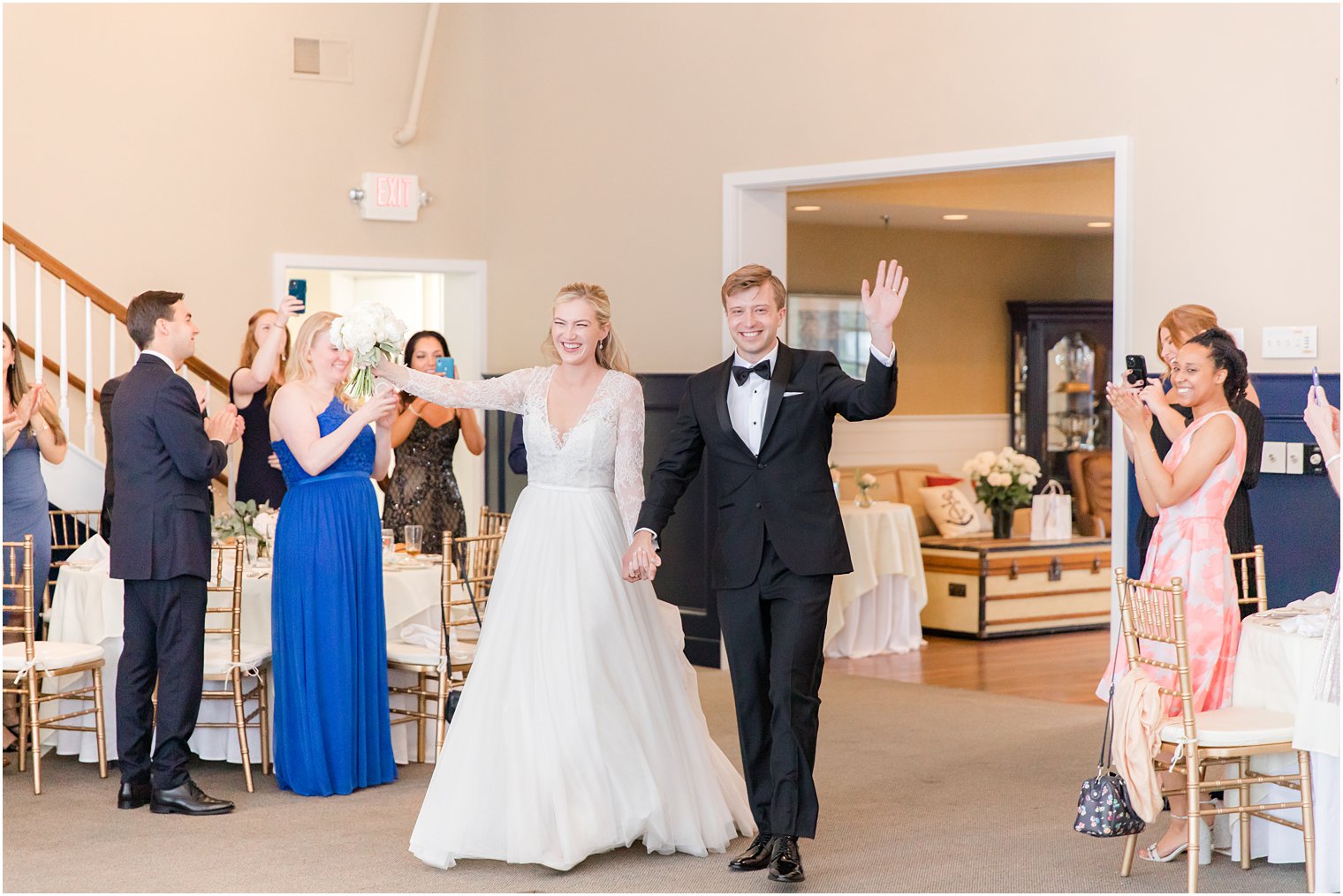 newlyweds enter wedding reception at Ocean City Yacht Club