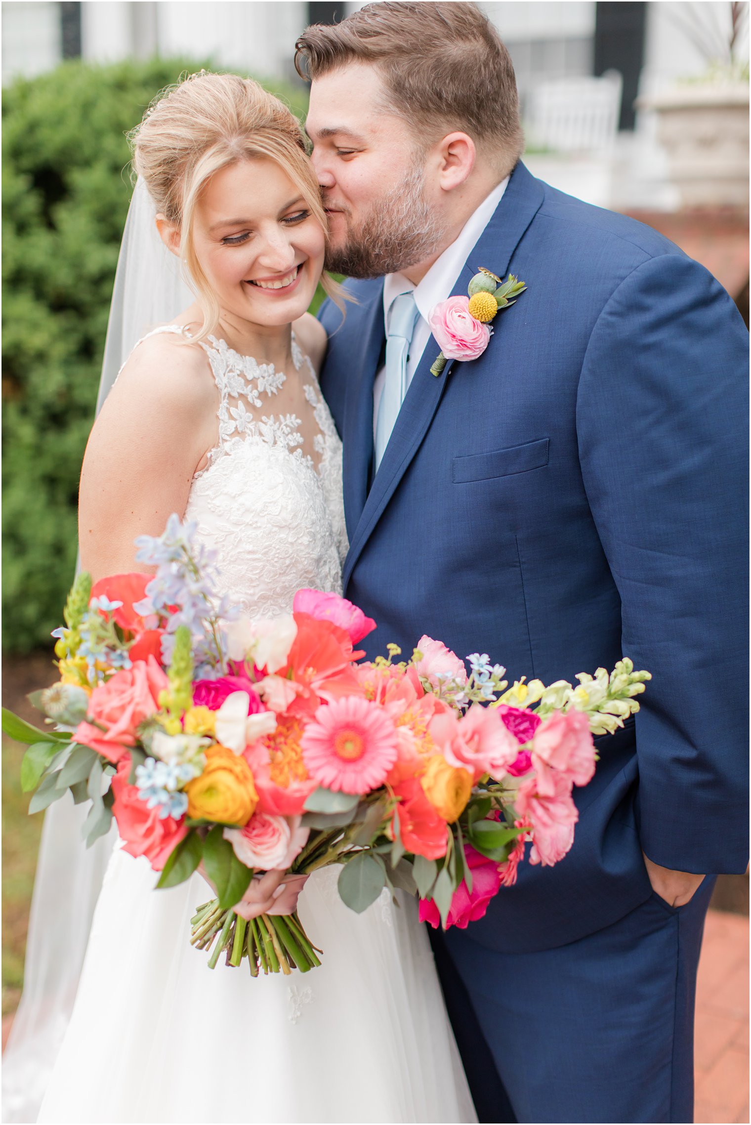 groom kisses bride's cheek during VA wedding photos
