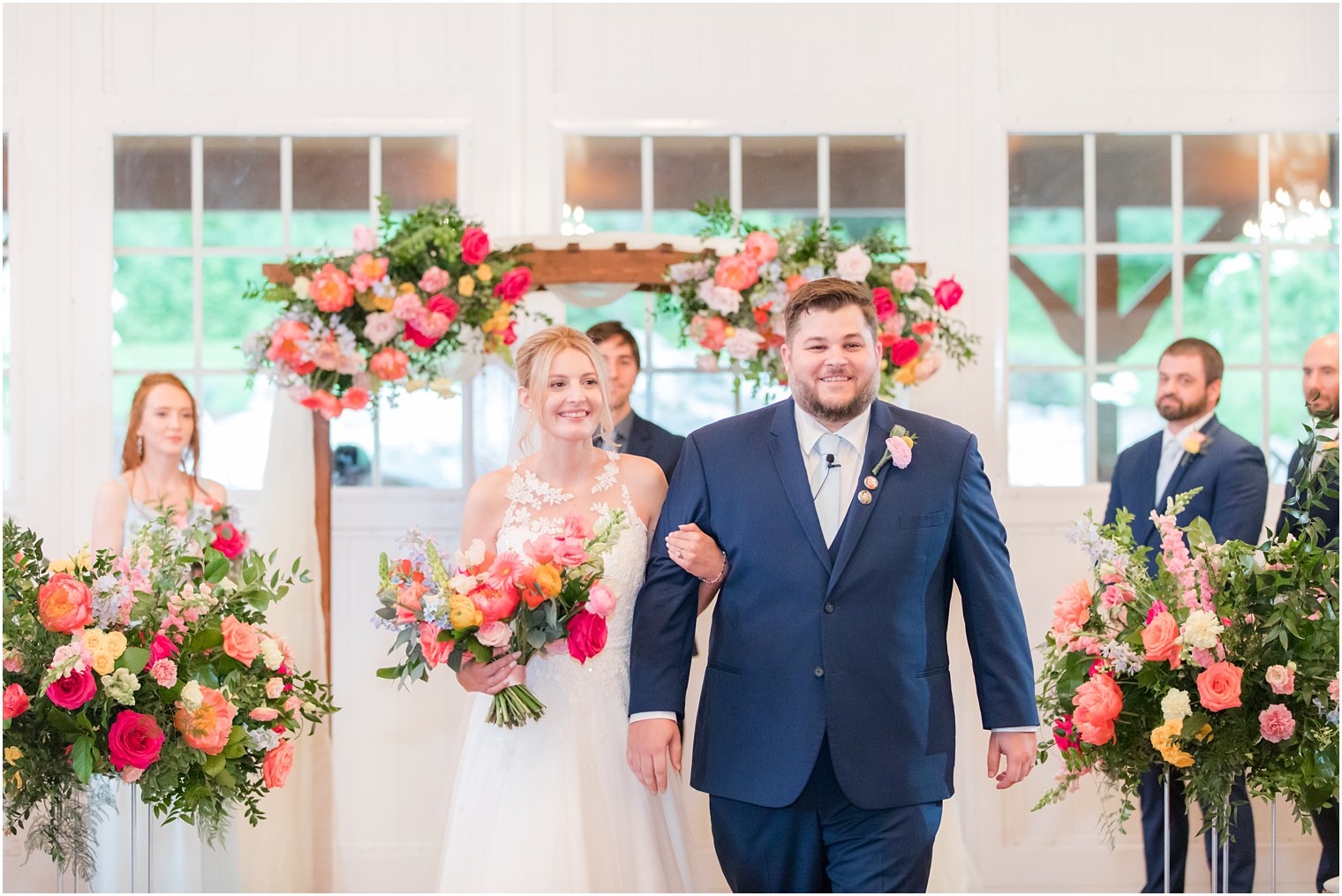 bride and groom walk up aisle after wedding ceremony in Virginia 