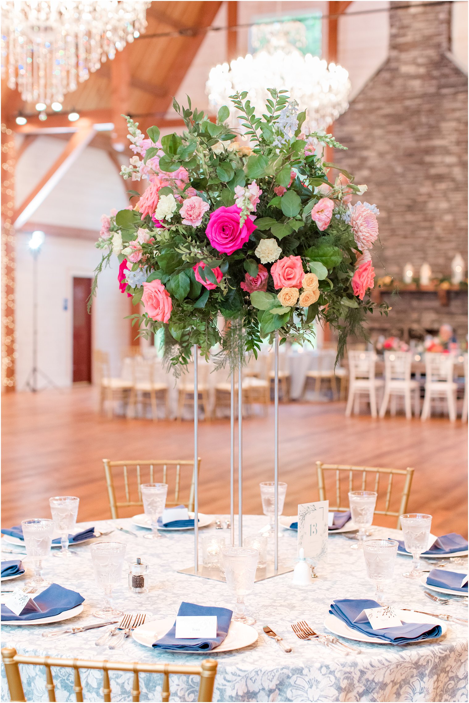 tall floral centerpieces with pink and orange roses 