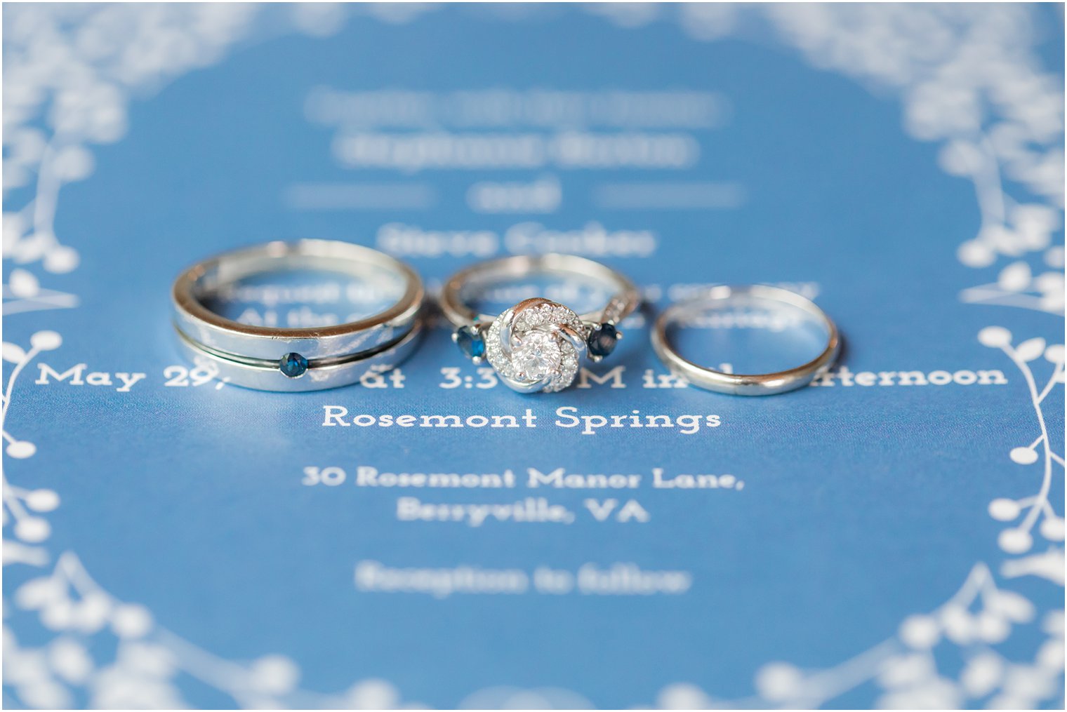 wedding rings rest on wedding invitation in VA