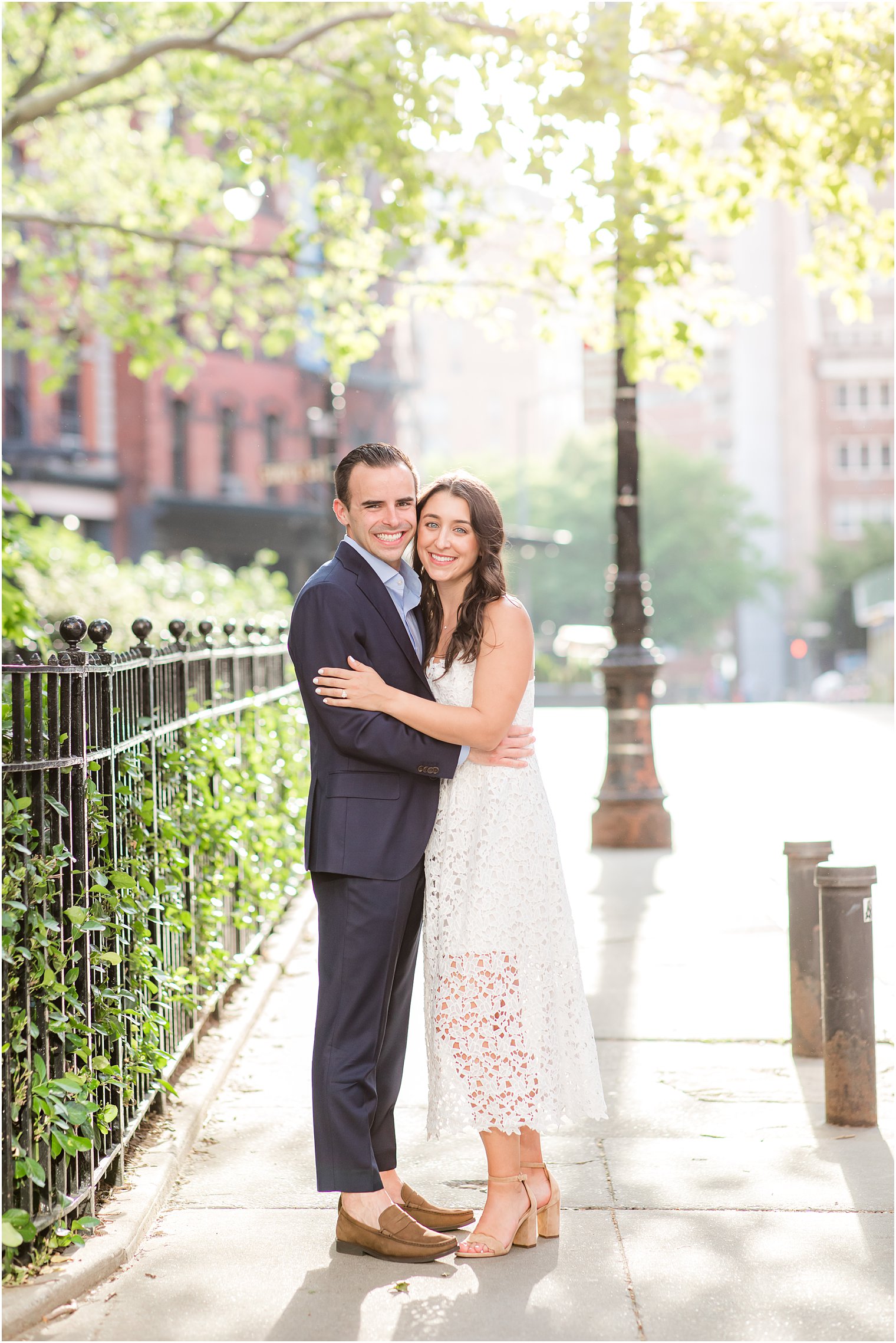 posed photo of engaged couple in Duane Park in Tribeca