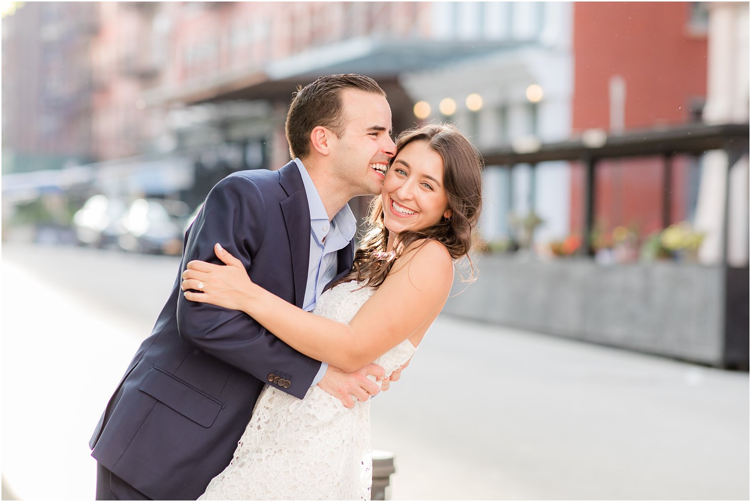 couple laughing after a kiss