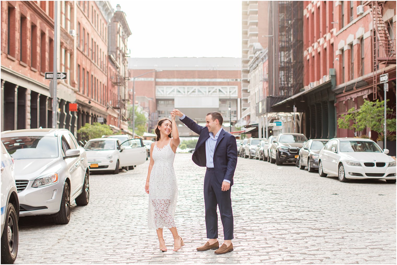 couple dancing on cobblestone street in Tribeca