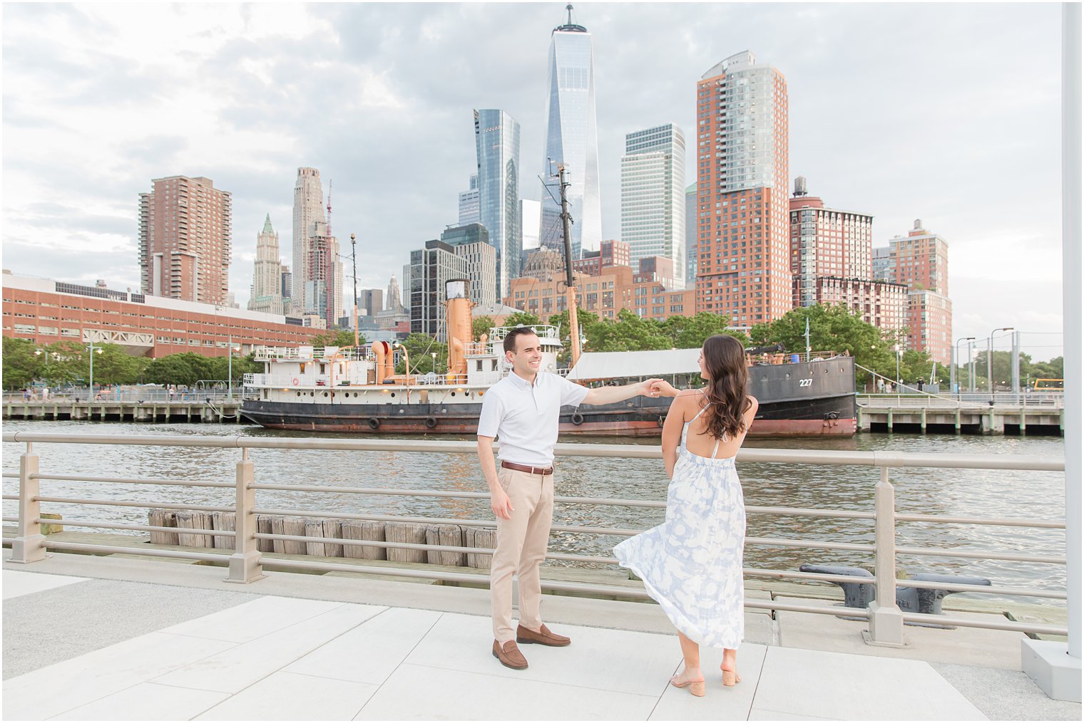 engaged couple dancing on Pier 26 in Tribeca engagement photos