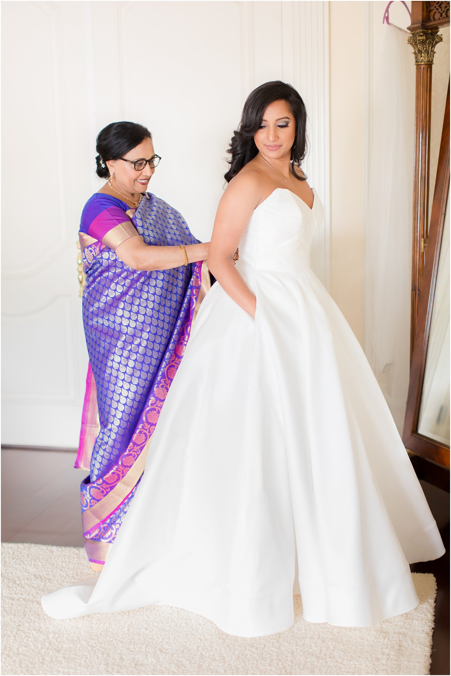 bride prepares for wedding day with mom