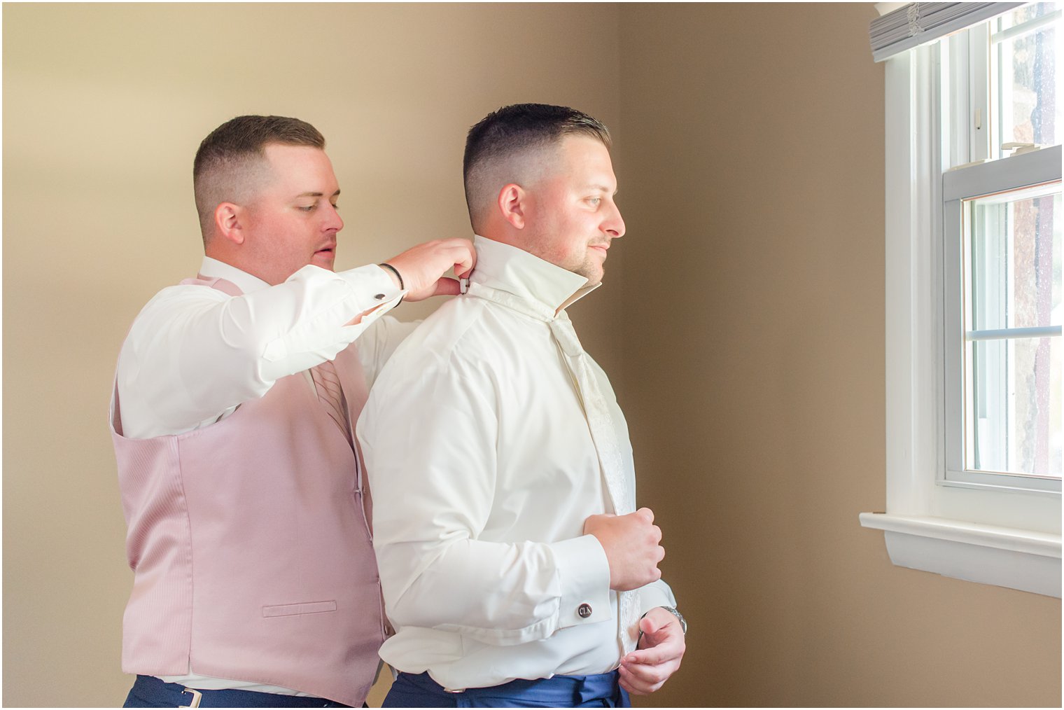 brother helps groom with tie before NJ wedding 