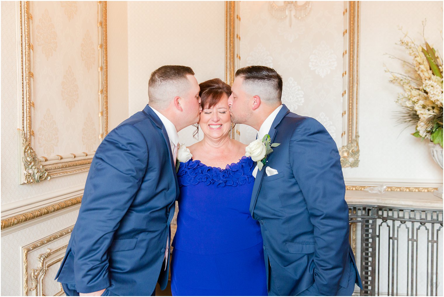 groom and brother kiss mom during NJ wedding photos 
