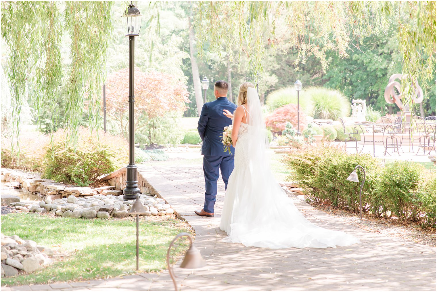 bride taps groom's shoulder for first look at Brigalias