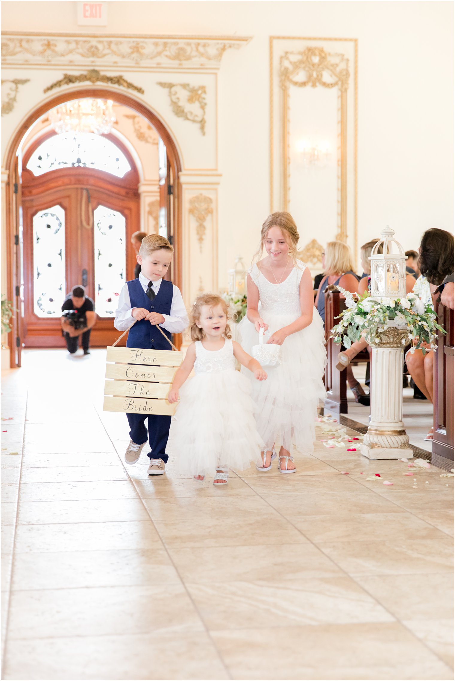 flower girls and ring bearer walk down aisle before NJ wedding ceremony 