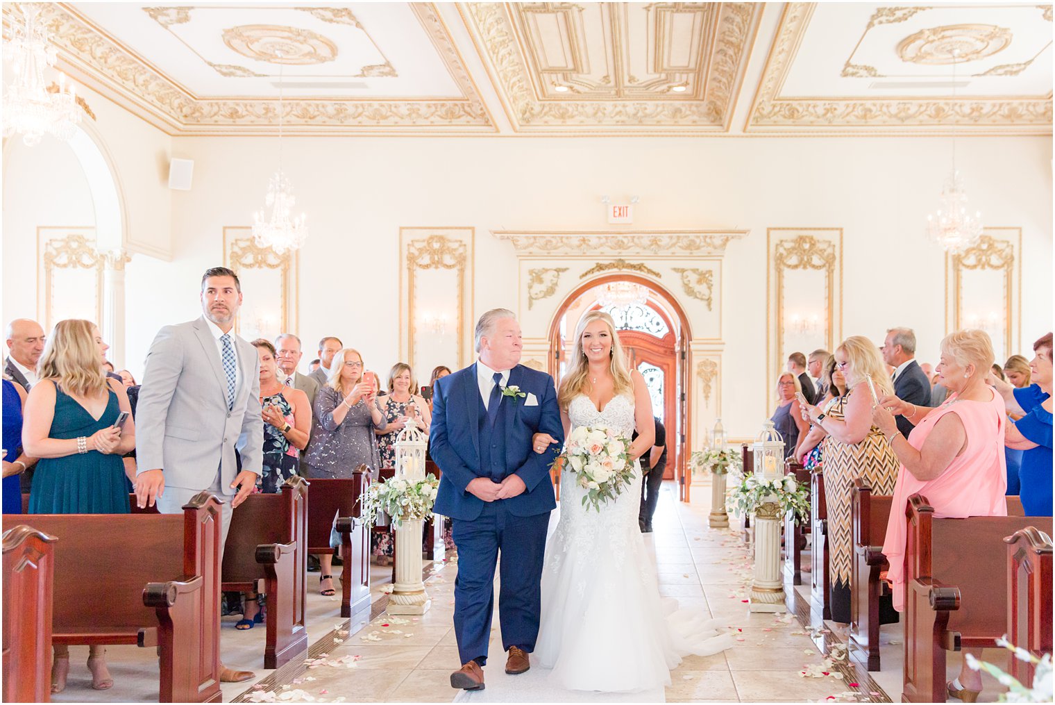 bride and father walk down aisle at Brigalias