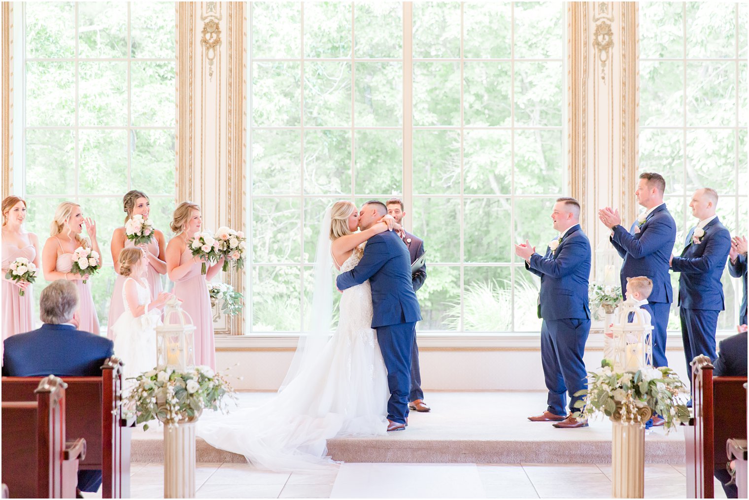 bride and groom kiss in New Jersey wedding ceremony at Brigalias