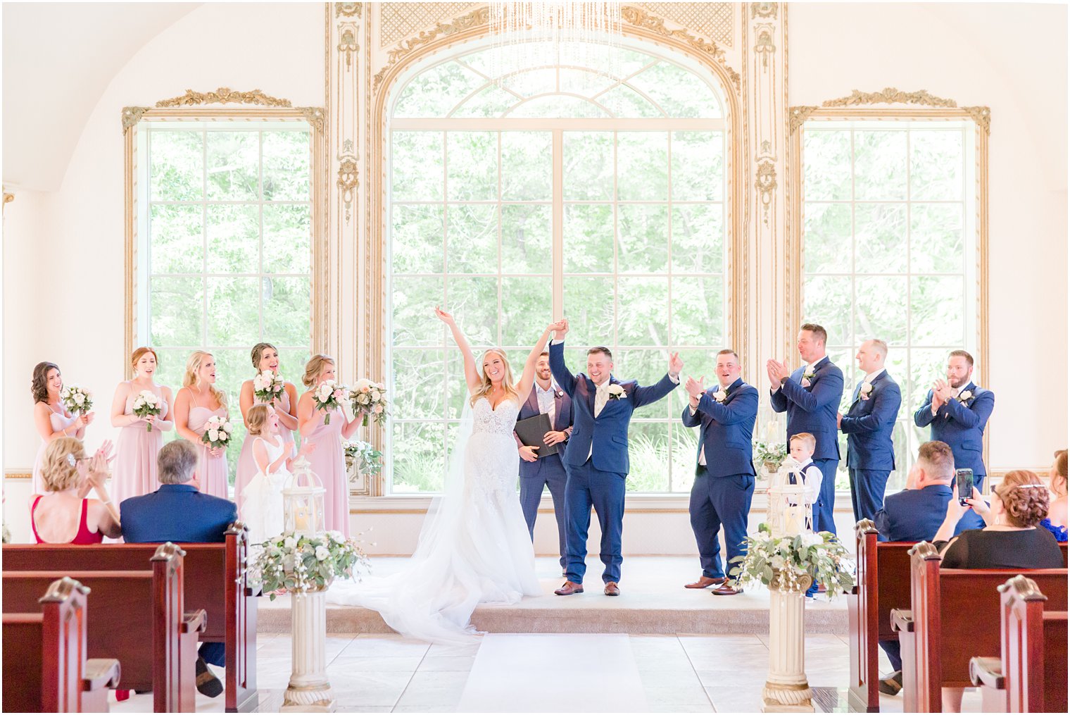 newlyweds cheer after ceremony at Brigalias