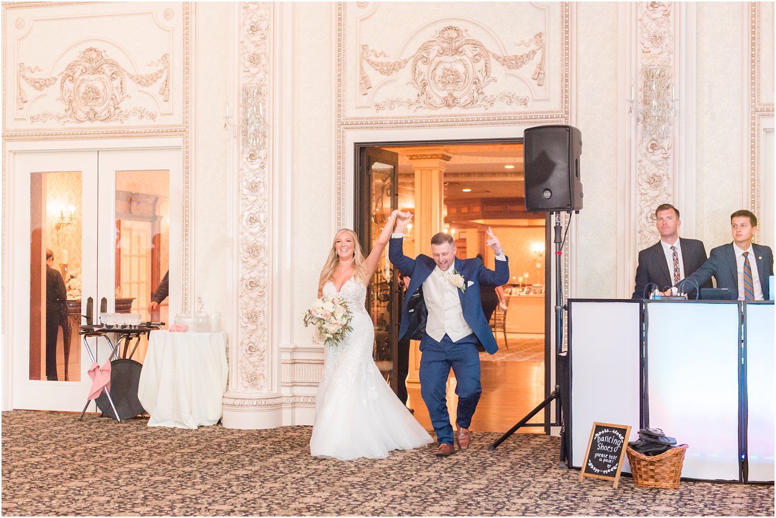 bride and groom enter wedding reception at Brigalias