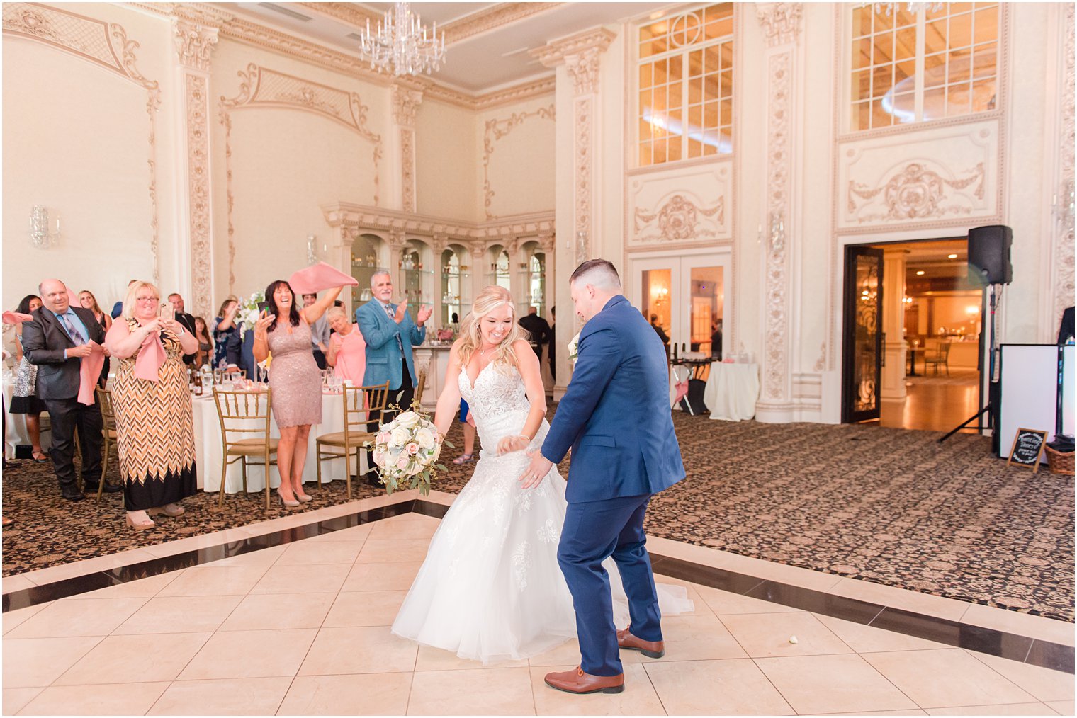 newlyweds enter wedding reception at Brigalias