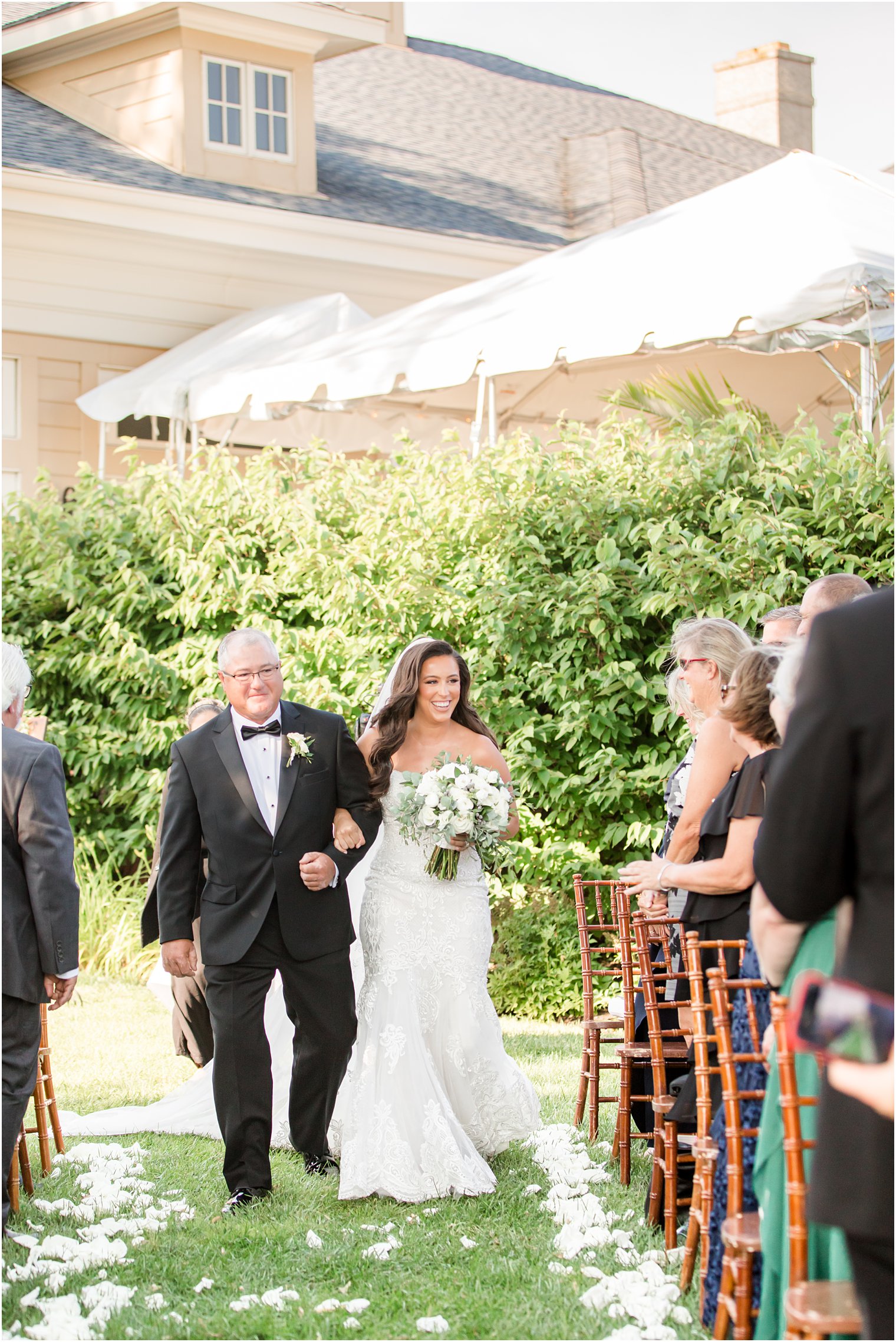 bride walks down aisle with dad at Navesink Country Club