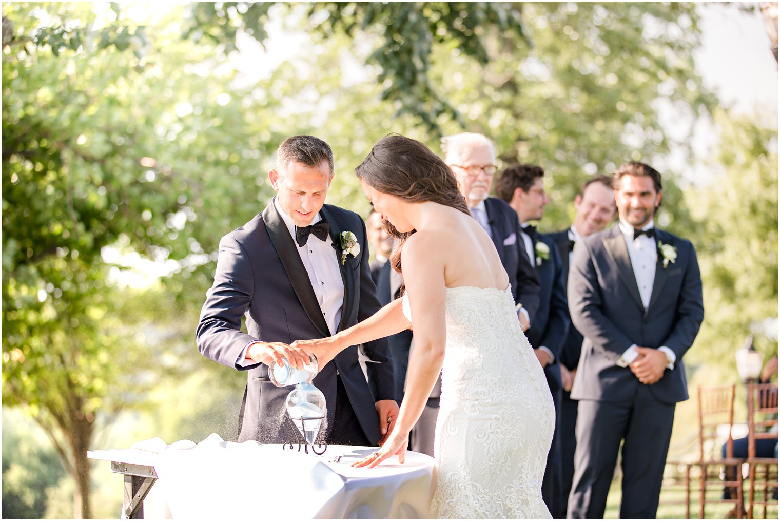 bride and groom complete sand ceremony during NJ wedding ceremony