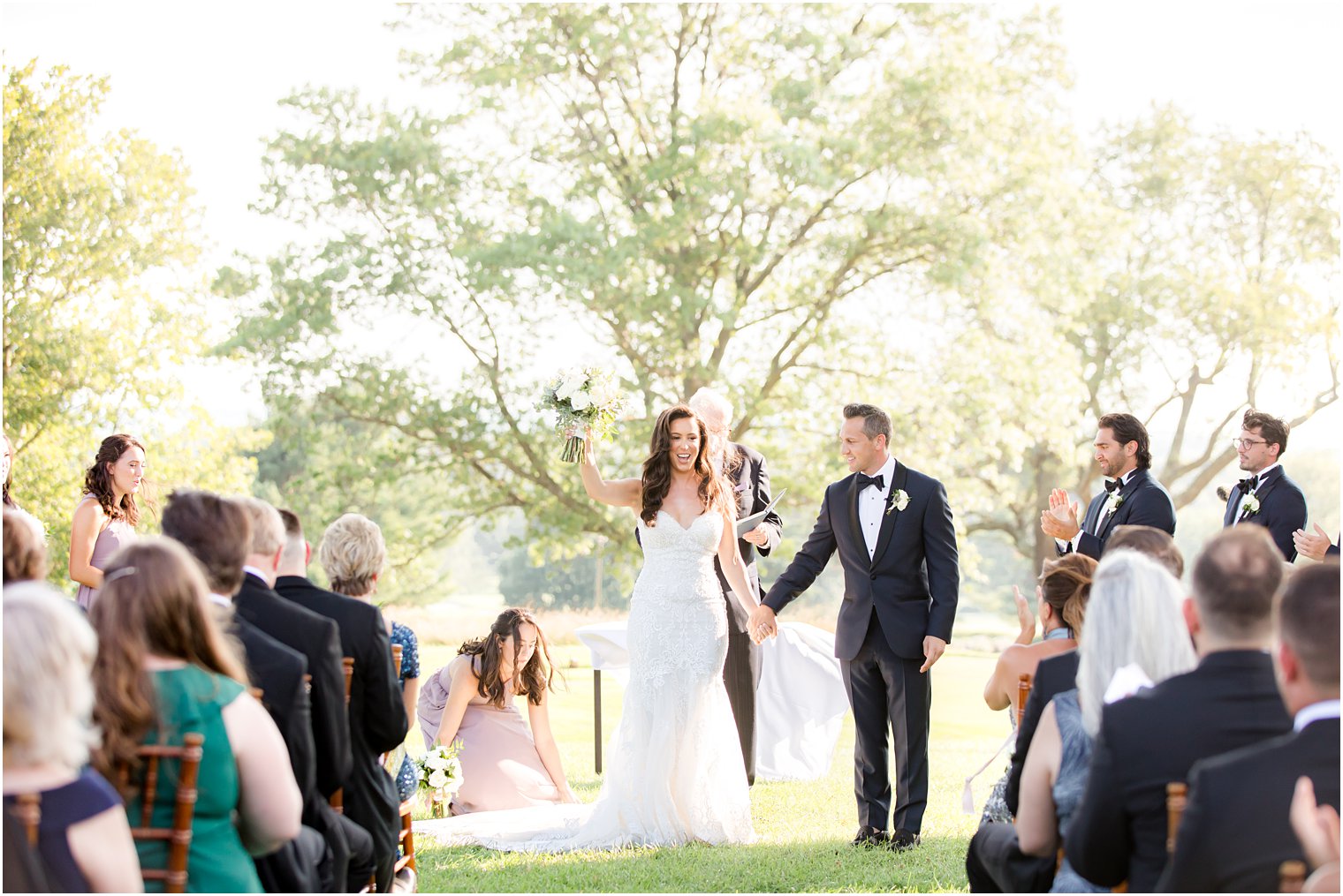 bride and groom cheer after ceremony in New Jersey 