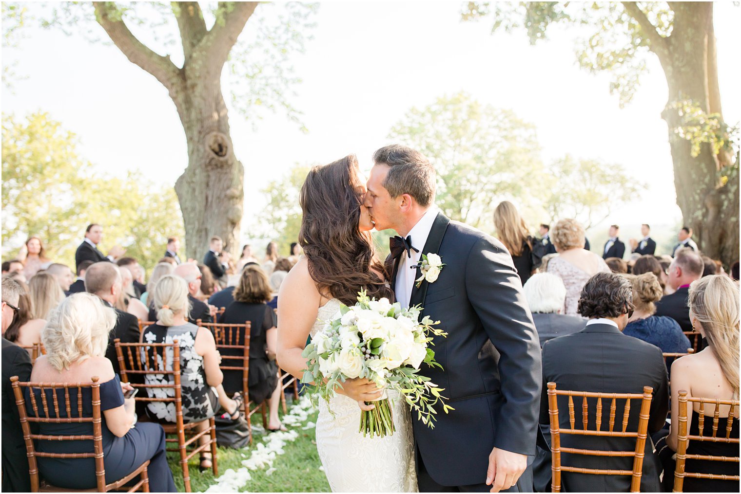 bride and groom kiss after recessional 