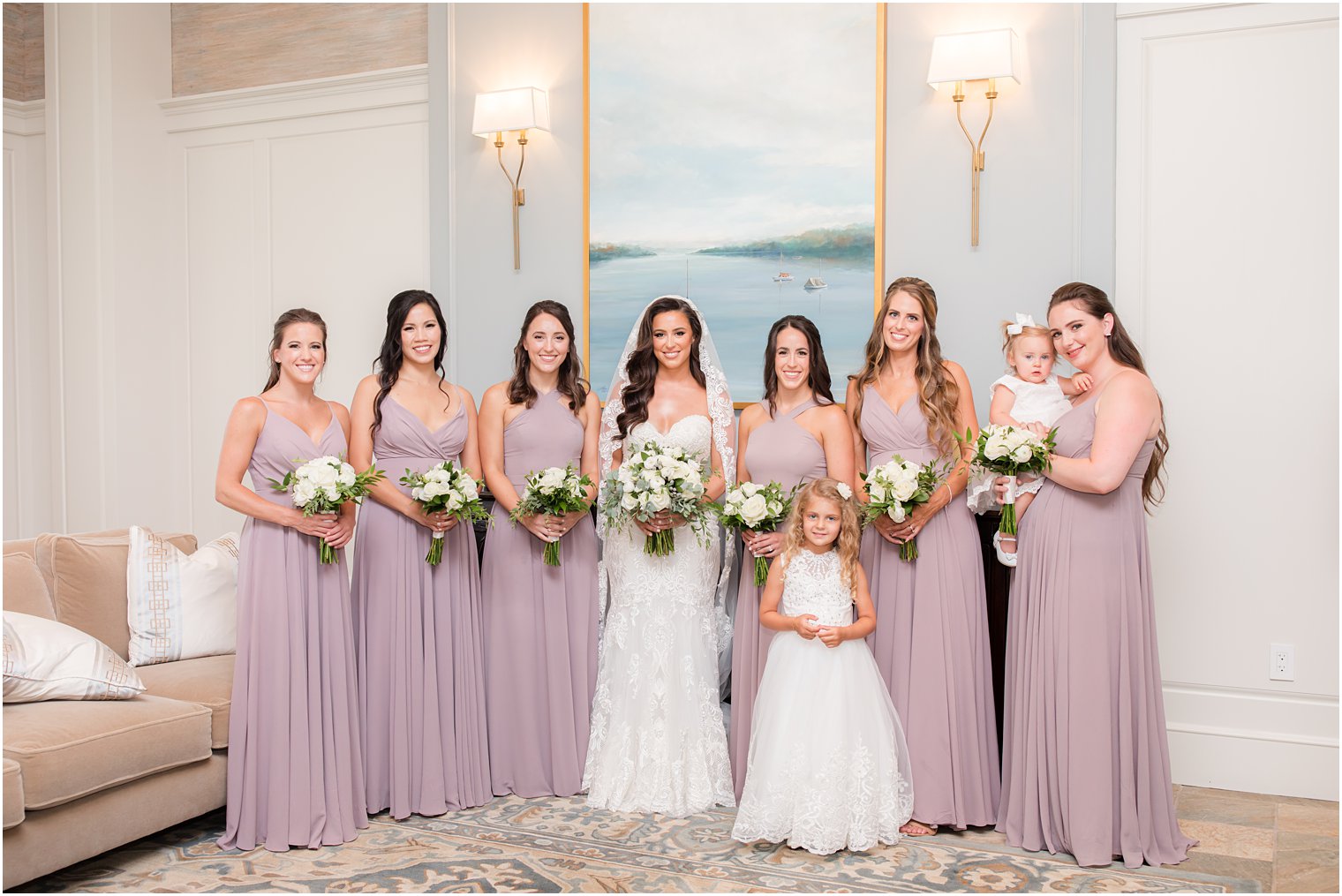 bride poses with bridesmaids inside Navesink Country Club