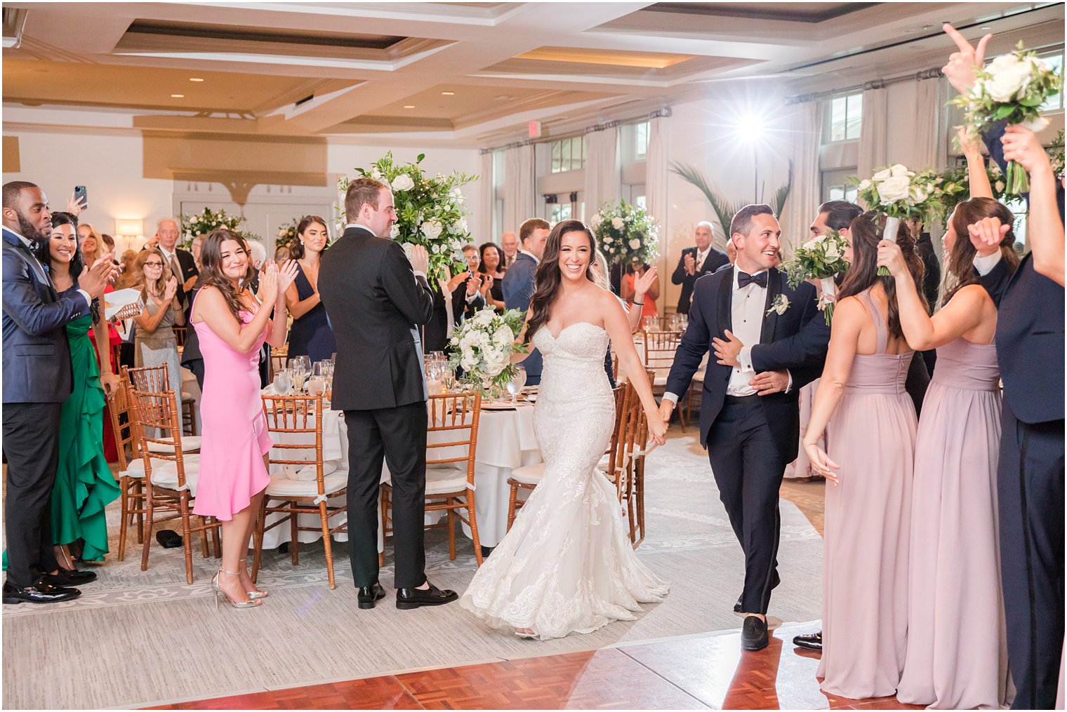 newlyweds walk into wedding reception in New Jersey