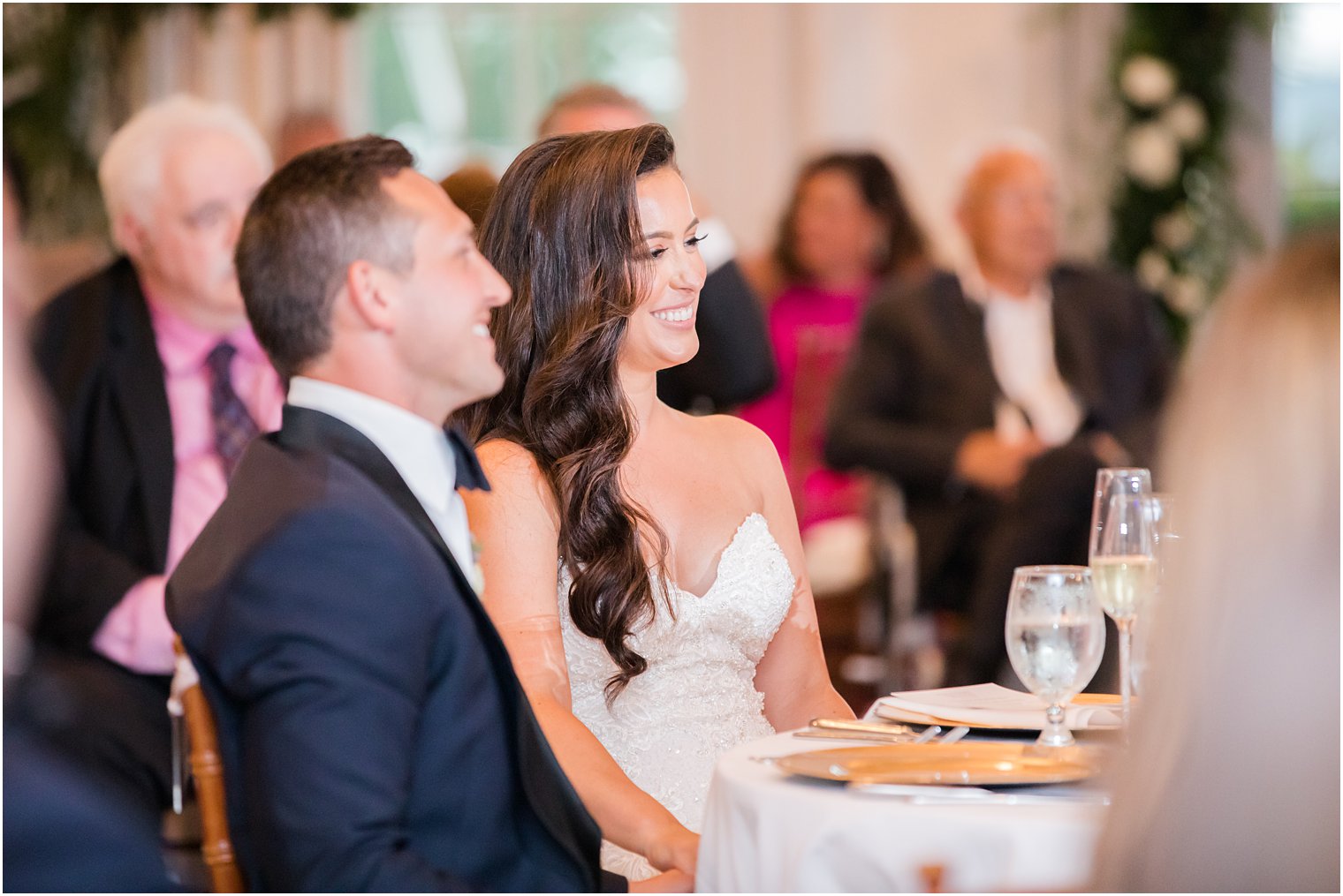 bride and groom laugh during NJ wedding reception 