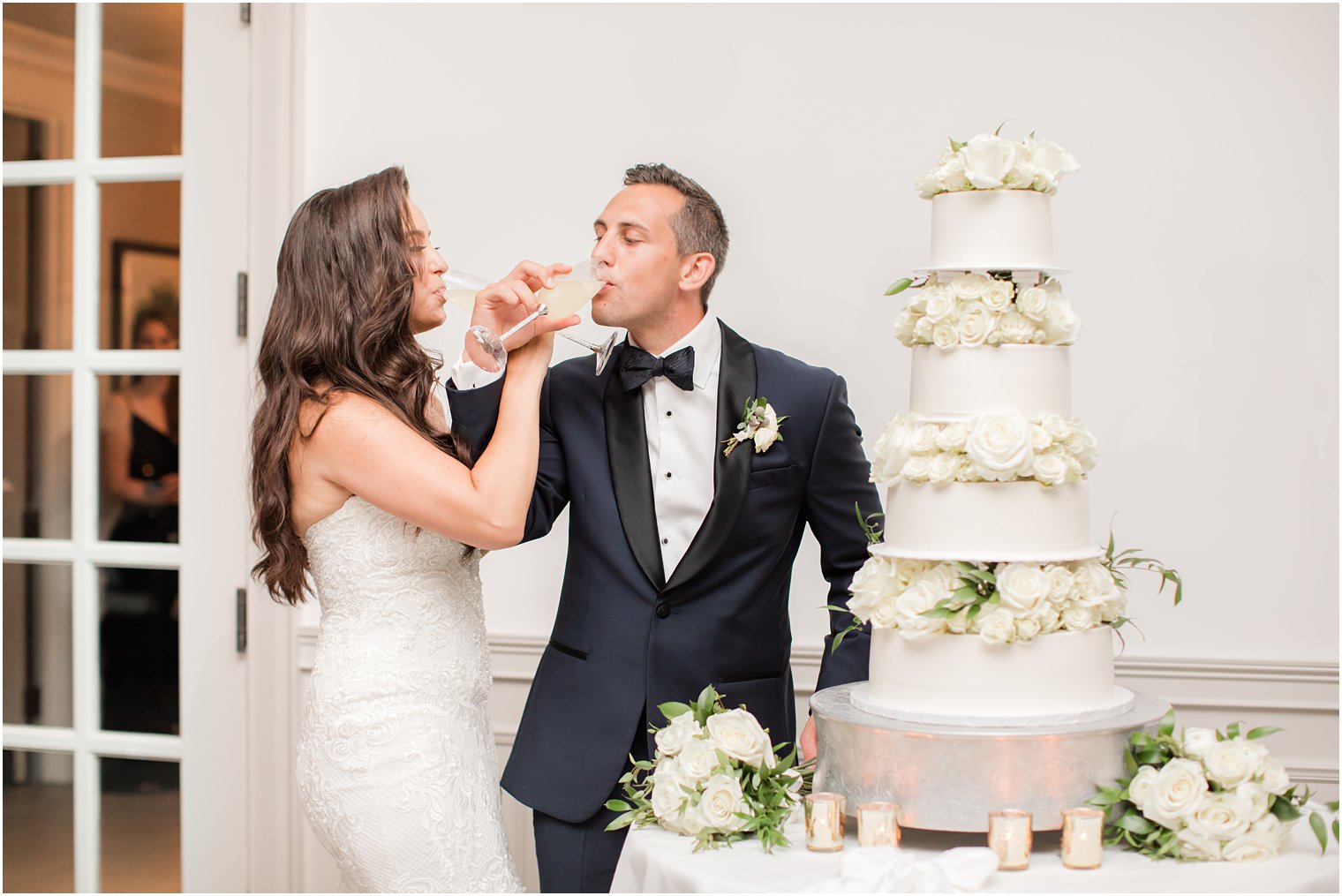 newlyweds cut wedding cake in Navesink Country Club