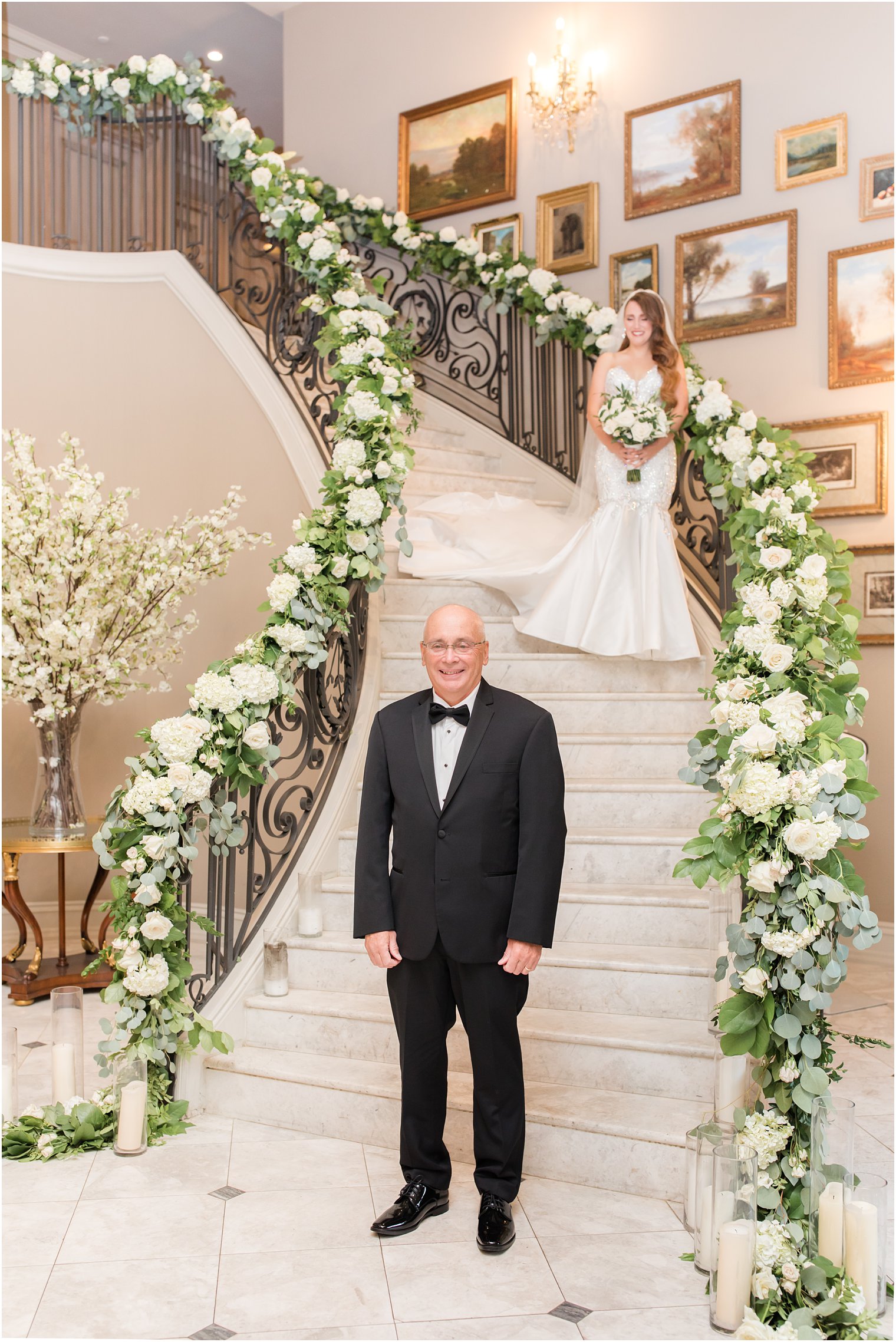 dad waits for daughter at end of staircase at Park Chateau Estate