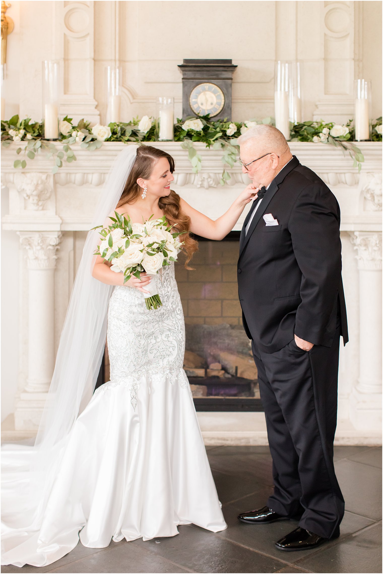 bride adjusts dad's tie during first look at Park Chateau Estate