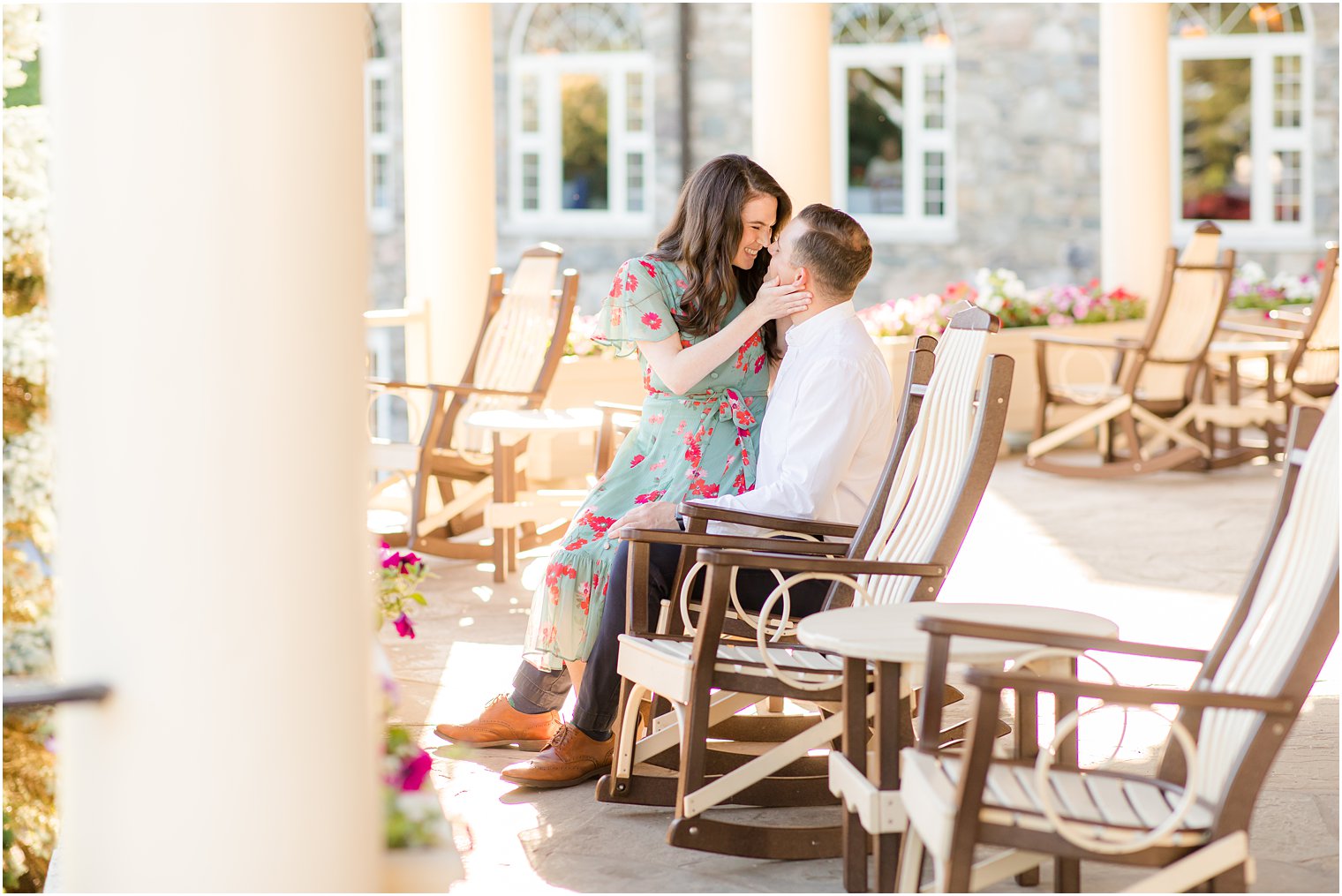 couple hugs on rocking chairs in the Poconos 