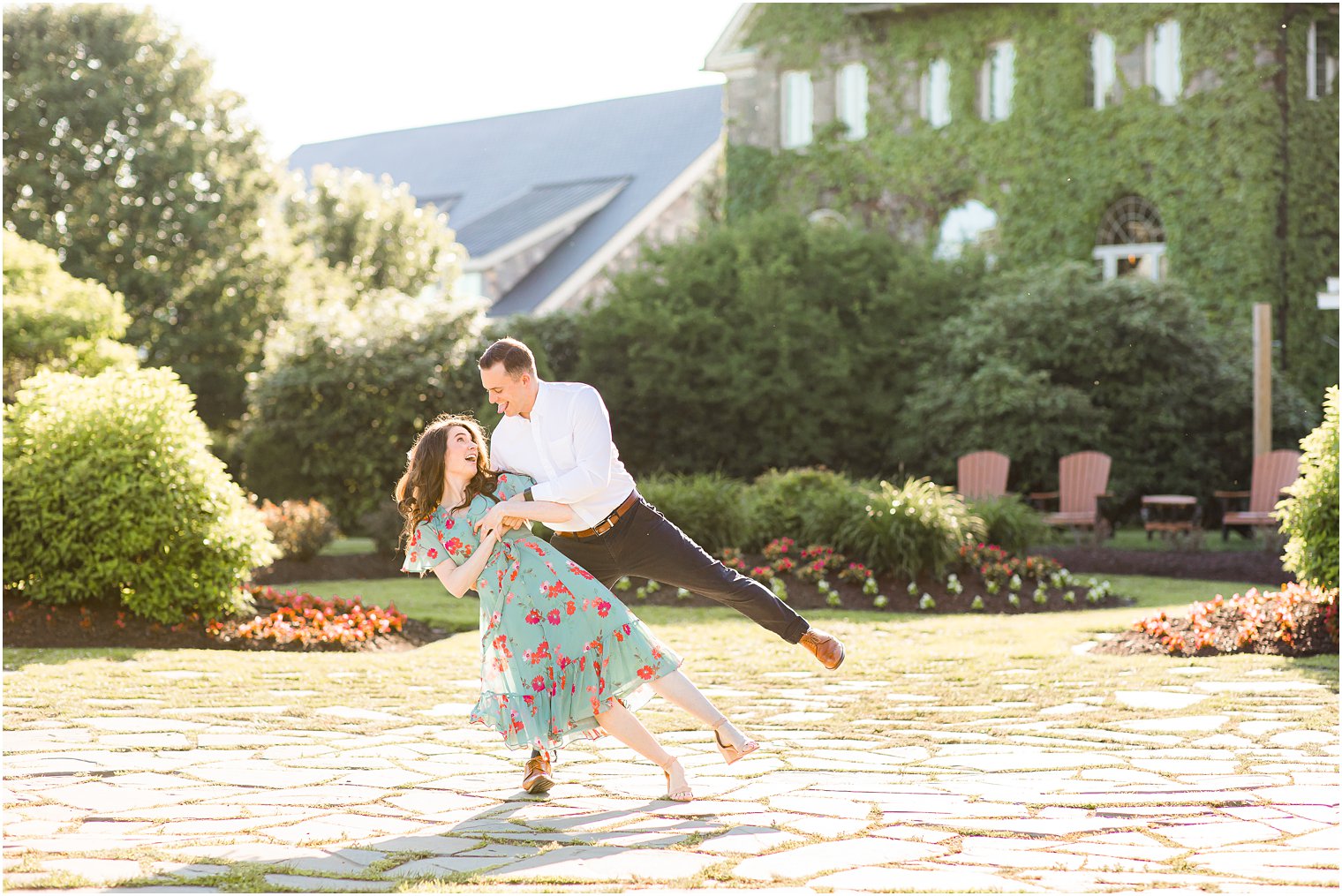 groom dips bride during engagement photos at the Skytop Lodge