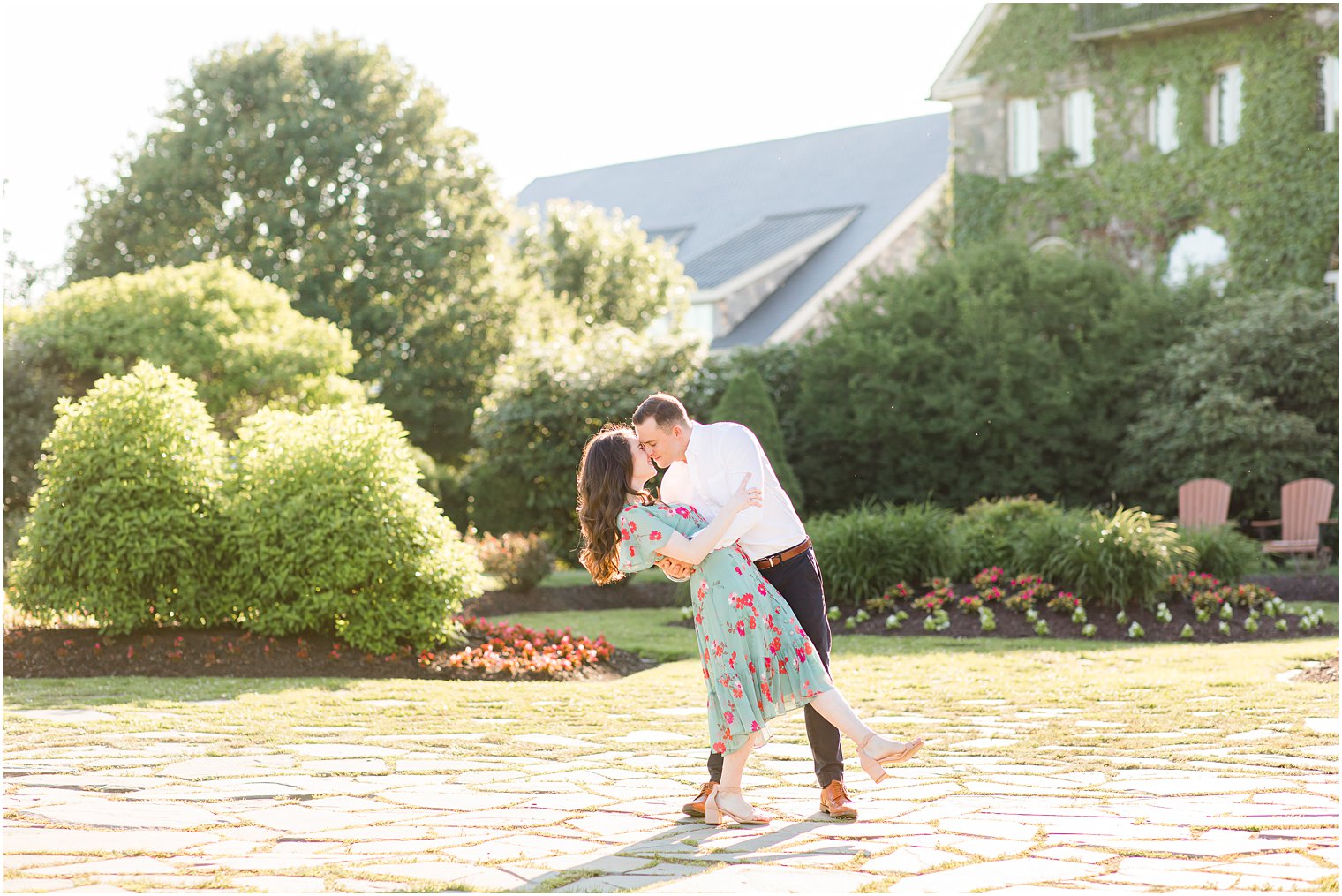 bride and groom kiss in courtyard in the Poconos PA