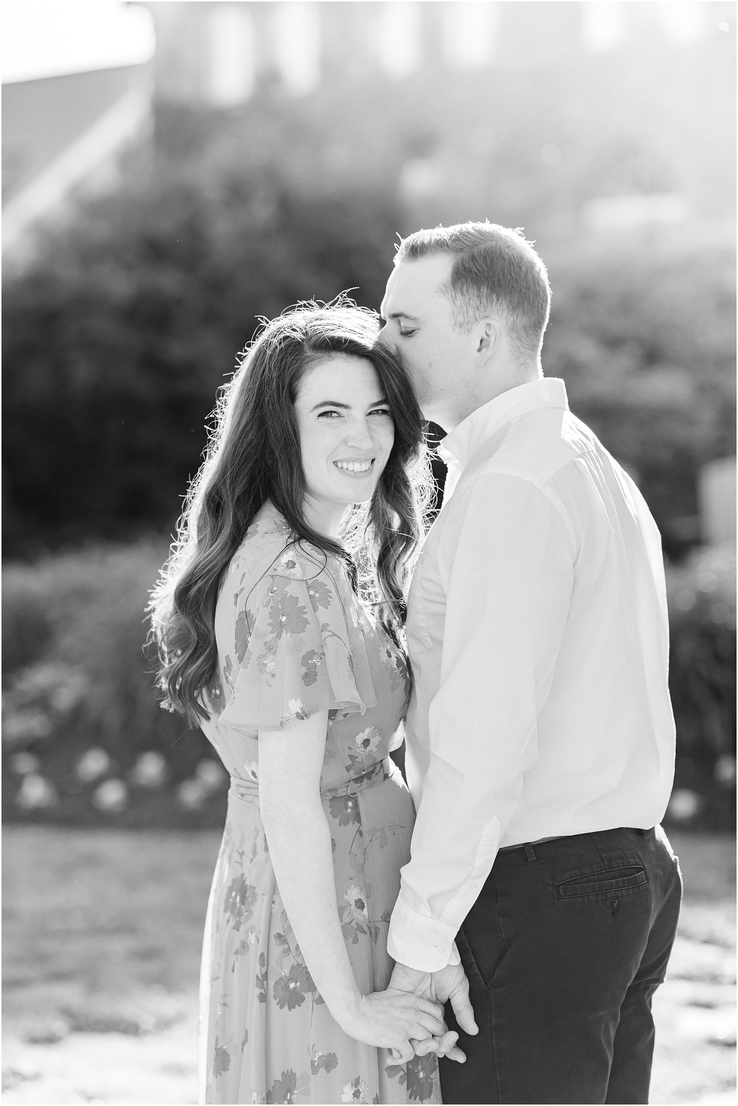 groom kisses bride's forehead during PA engagement photos