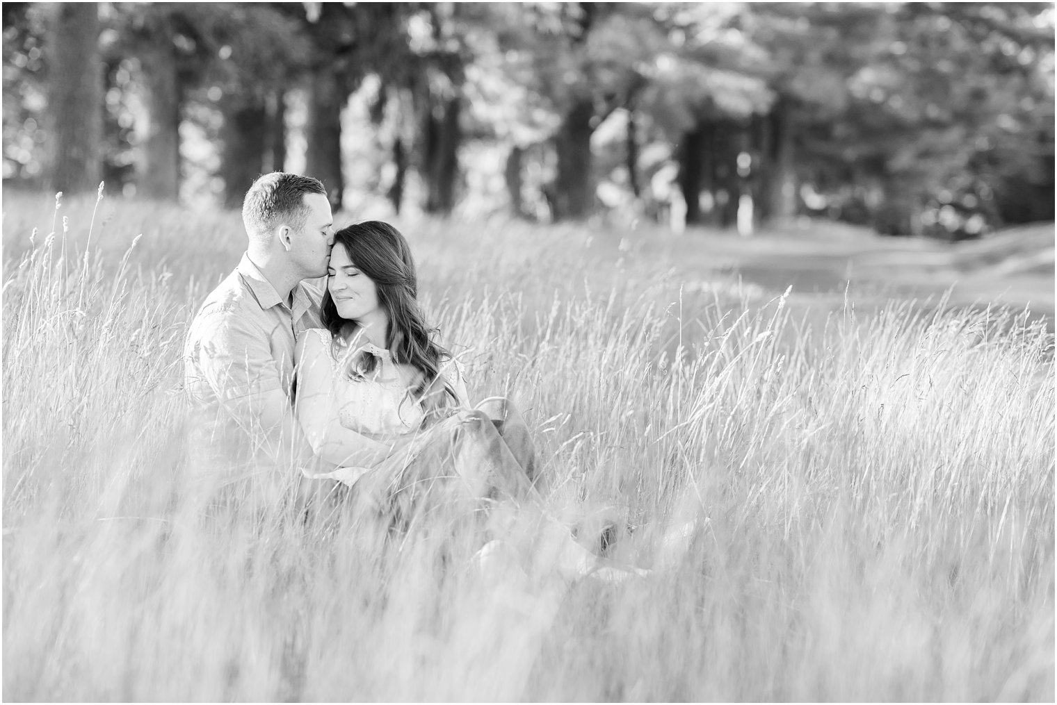 groom holds bride in his arms during PA engagement session