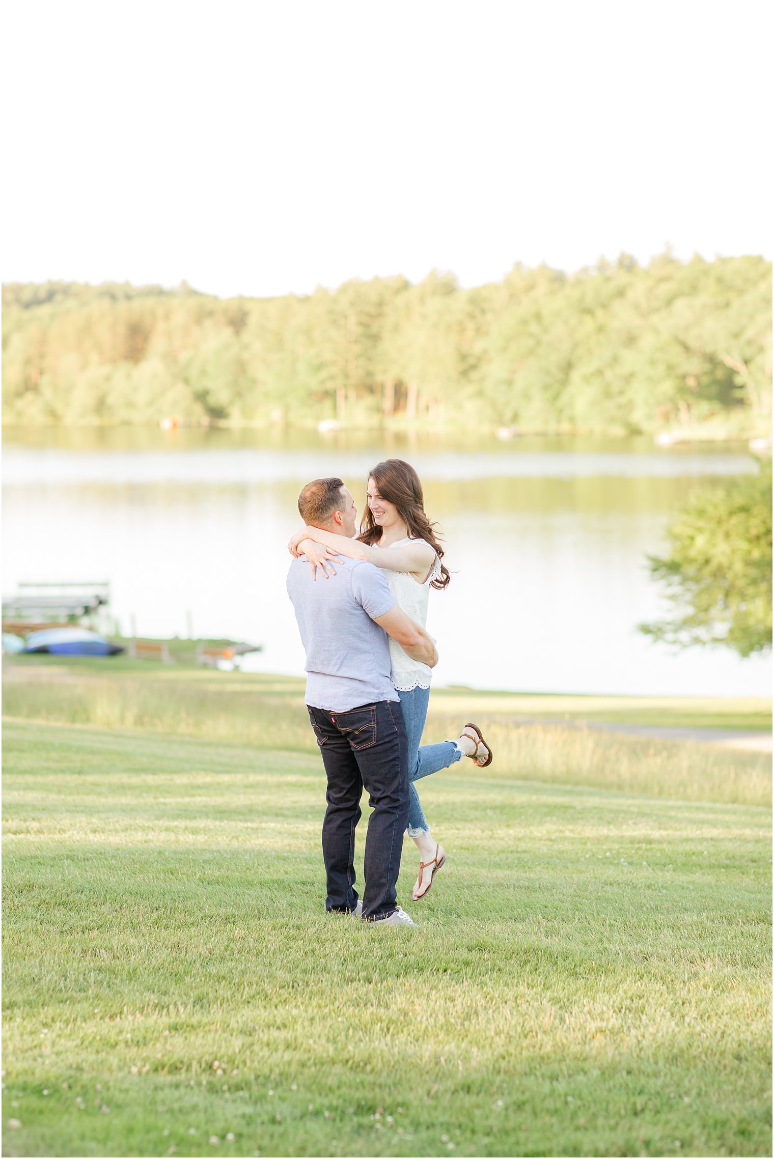 groom lifts bride during engagement session in Pennsylvania