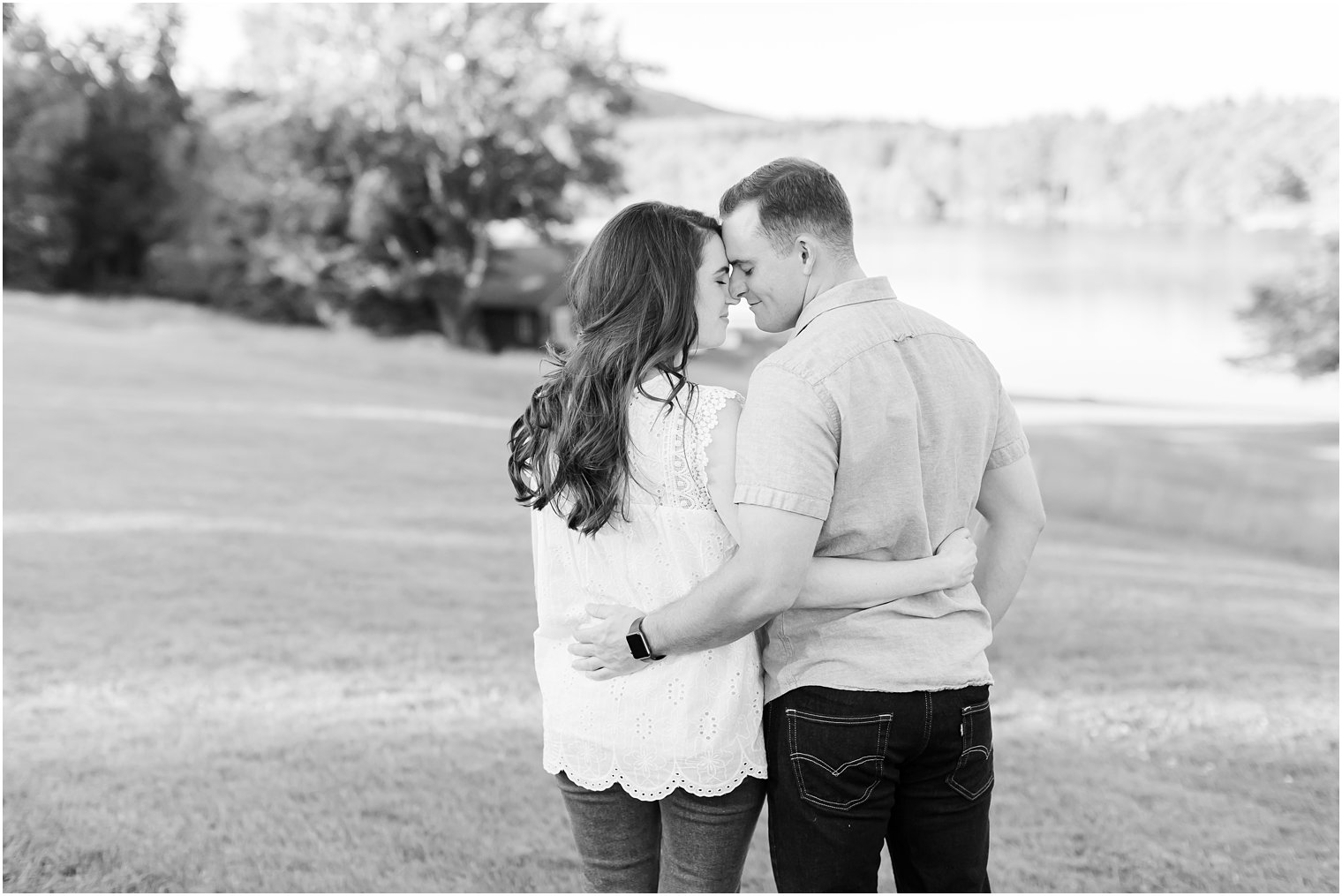 bride and groom nuzzle noses during engagement portraits in PA