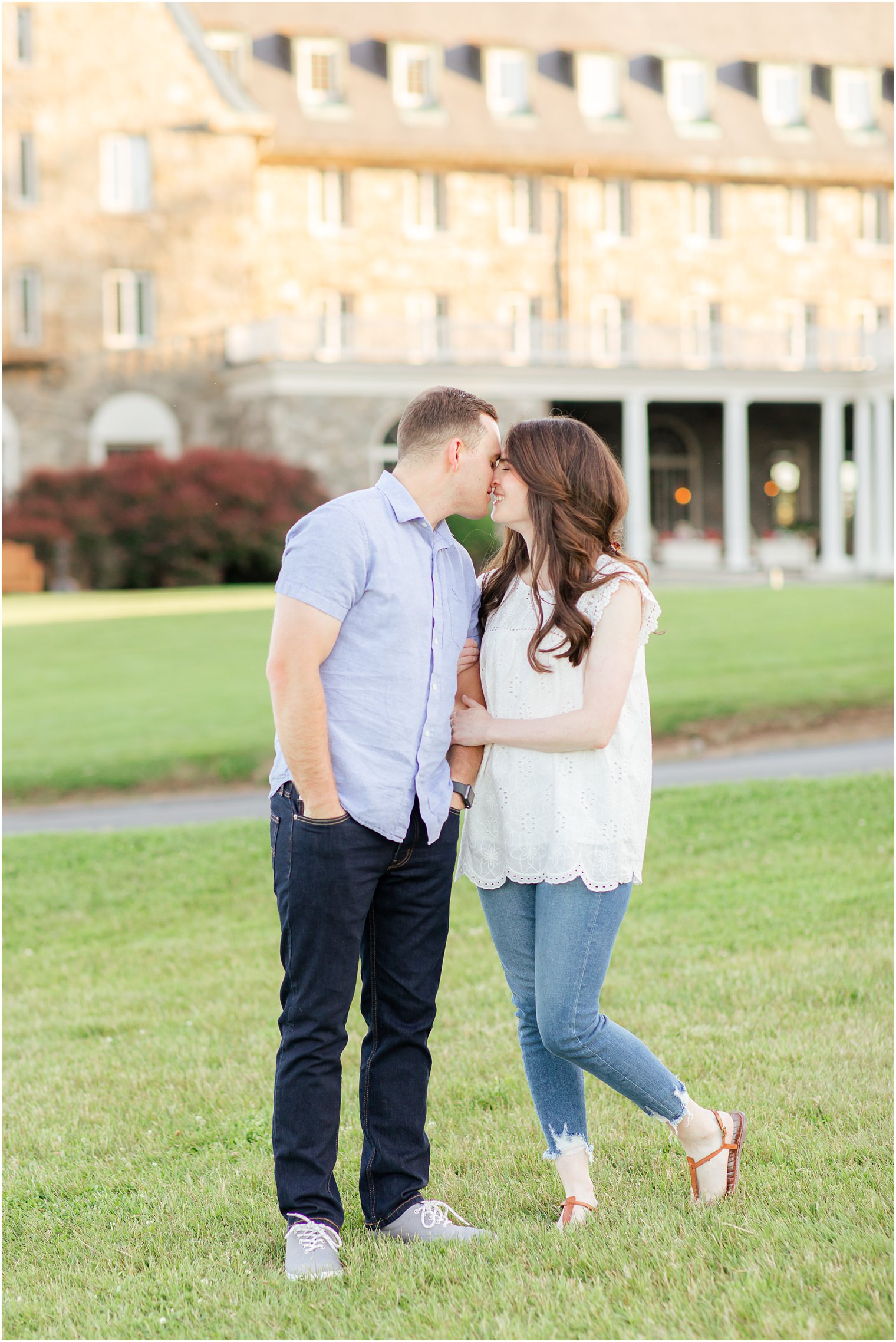 bride and groom kiss pose together outside hotel in the Poconos PA